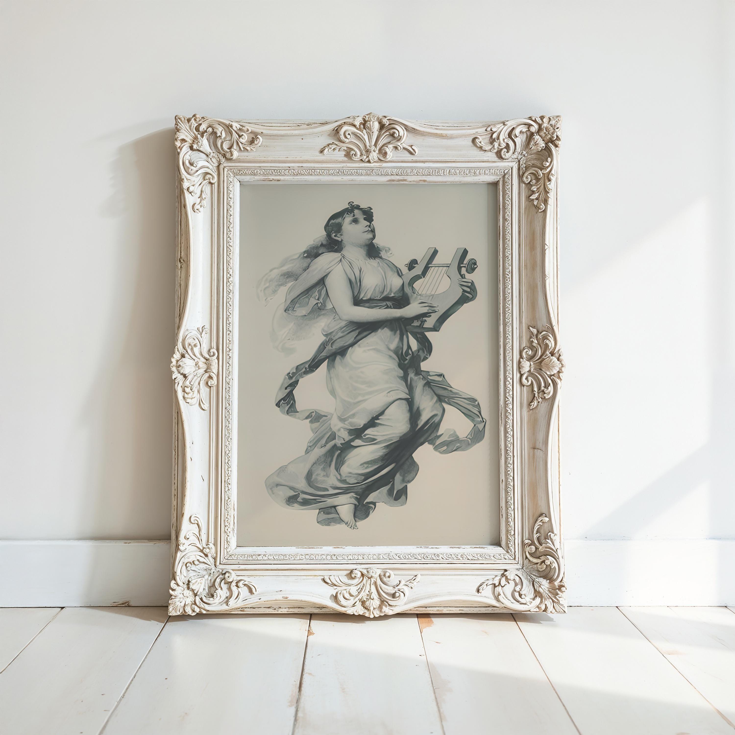 The Victorian Home Decor – Vintage Art Prints features a framed vintage print of a classical woman with a harp, set against a white wall and light wooden floor—a perfect blend of elegance and nostalgia for your space.
