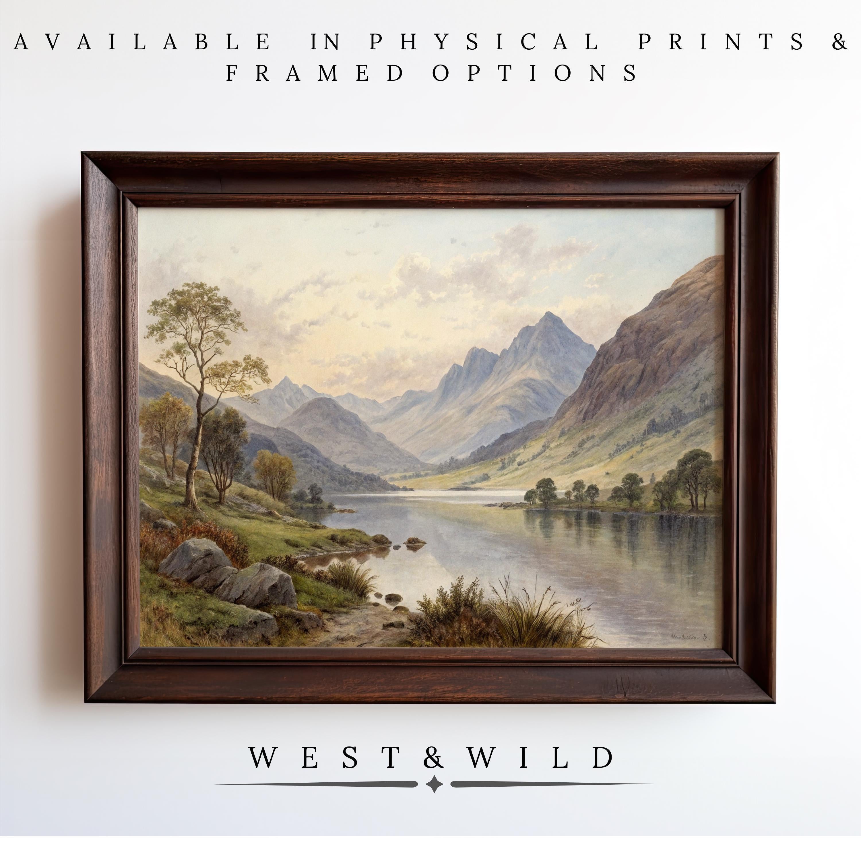 A framed Mountain Landscape Painting—Rustic Cabin Wall Art with watercolor print—hangs on a white wall. Above: Available in archival quality prints & framed options. Below: WEST & WILD ART ARCHIVE.