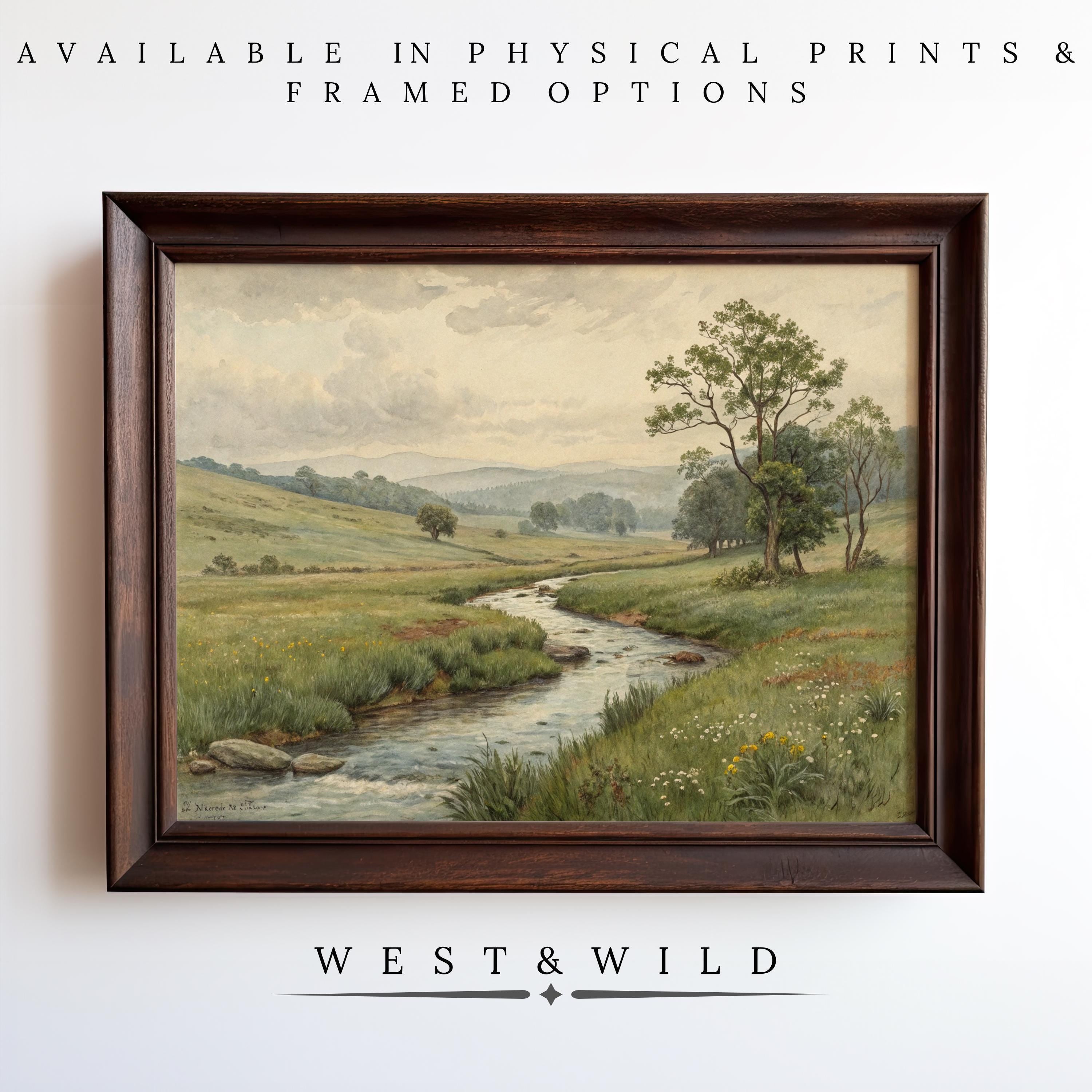 The Meadow Creek Painting – Rustic Wall Art features a serene countryside with a stream, grassy fields, wildflowers, and distant hills. Archival quality ensures lasting beauty. Available as prints or framed from West & Wild Art Archive.