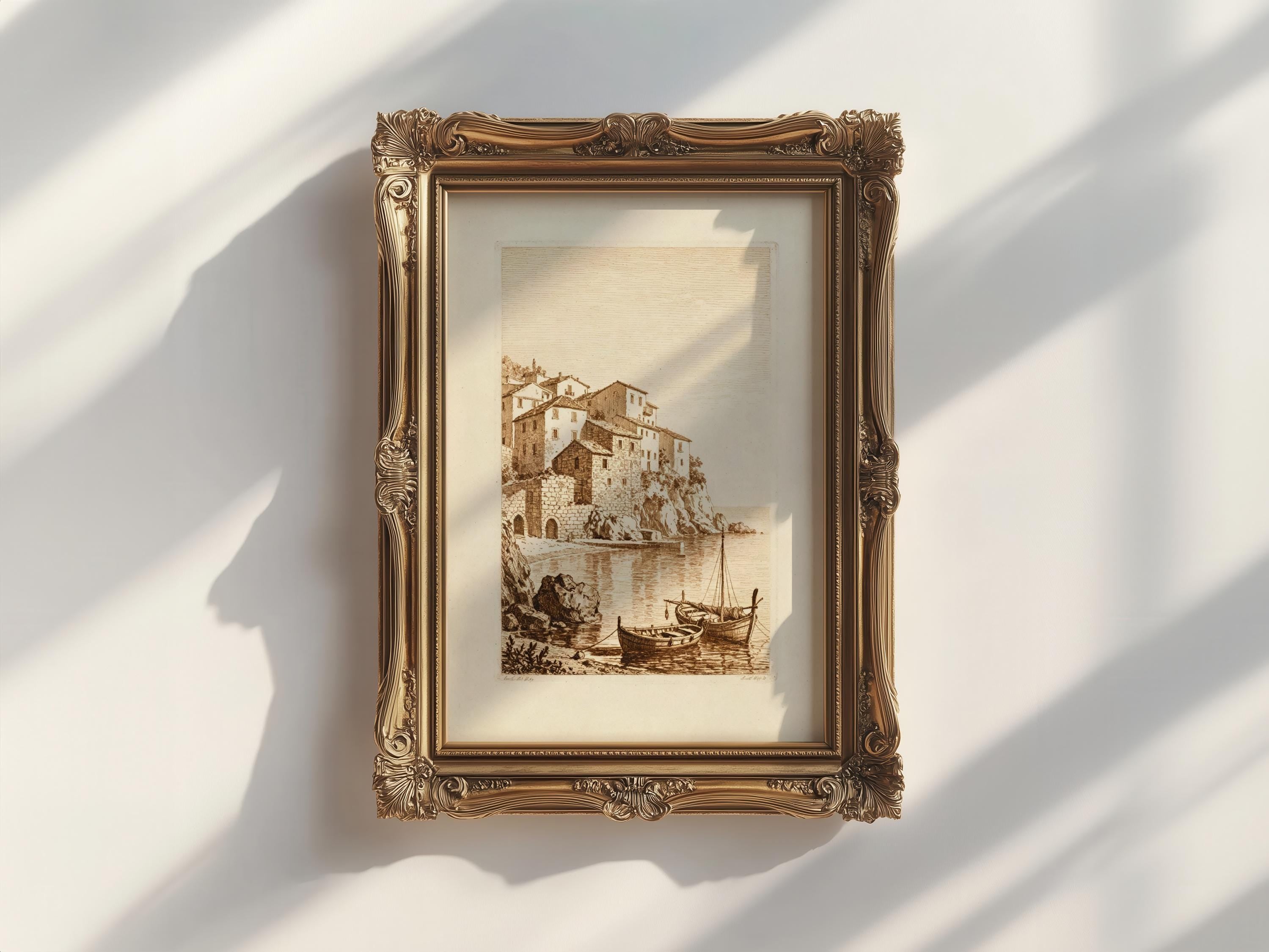 a framed painting of a coastal scene with boats and buildings, hanging on a white wall.