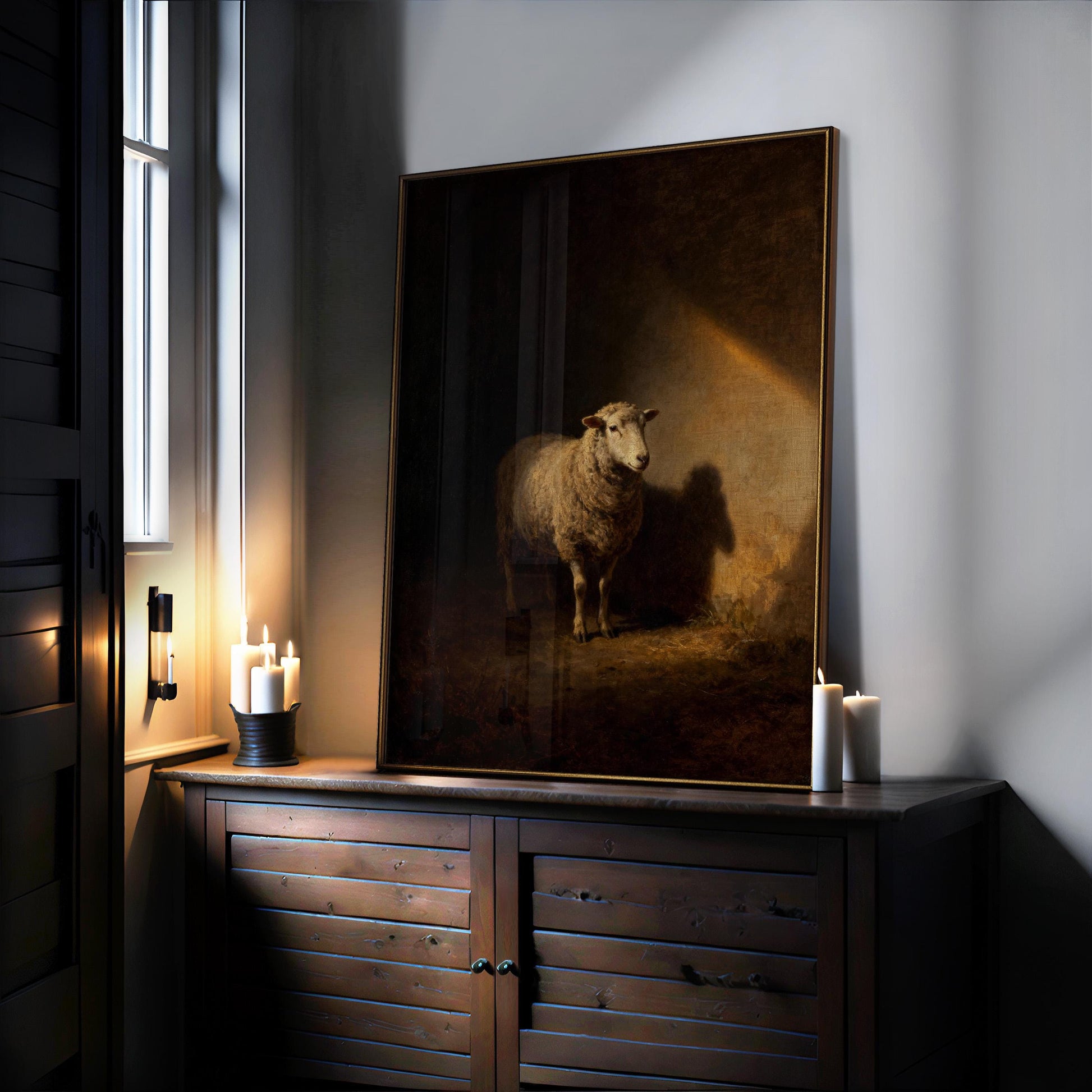 a large painting of a sheep on a wooden cabinet, with candles and a window in the background.