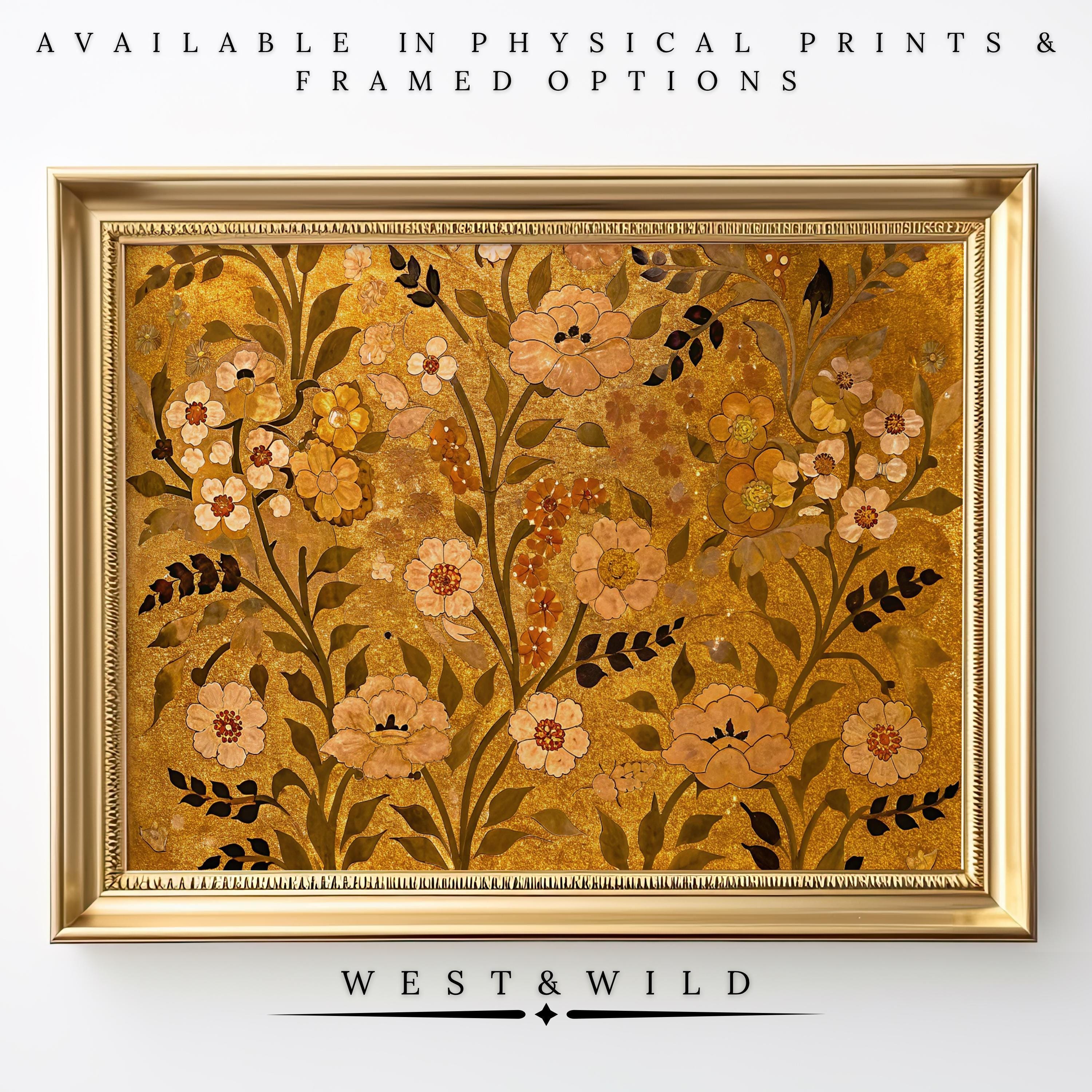 A framed Gold Floral Wall Art with cream amber flowers and an ornate gold frame is displayed. Above, text reads AVAILABLE IN PHYSICAL PRINTS & FRAMED OPTIONS; below, the centered brand name WEST&WILD marks this vintage art print.