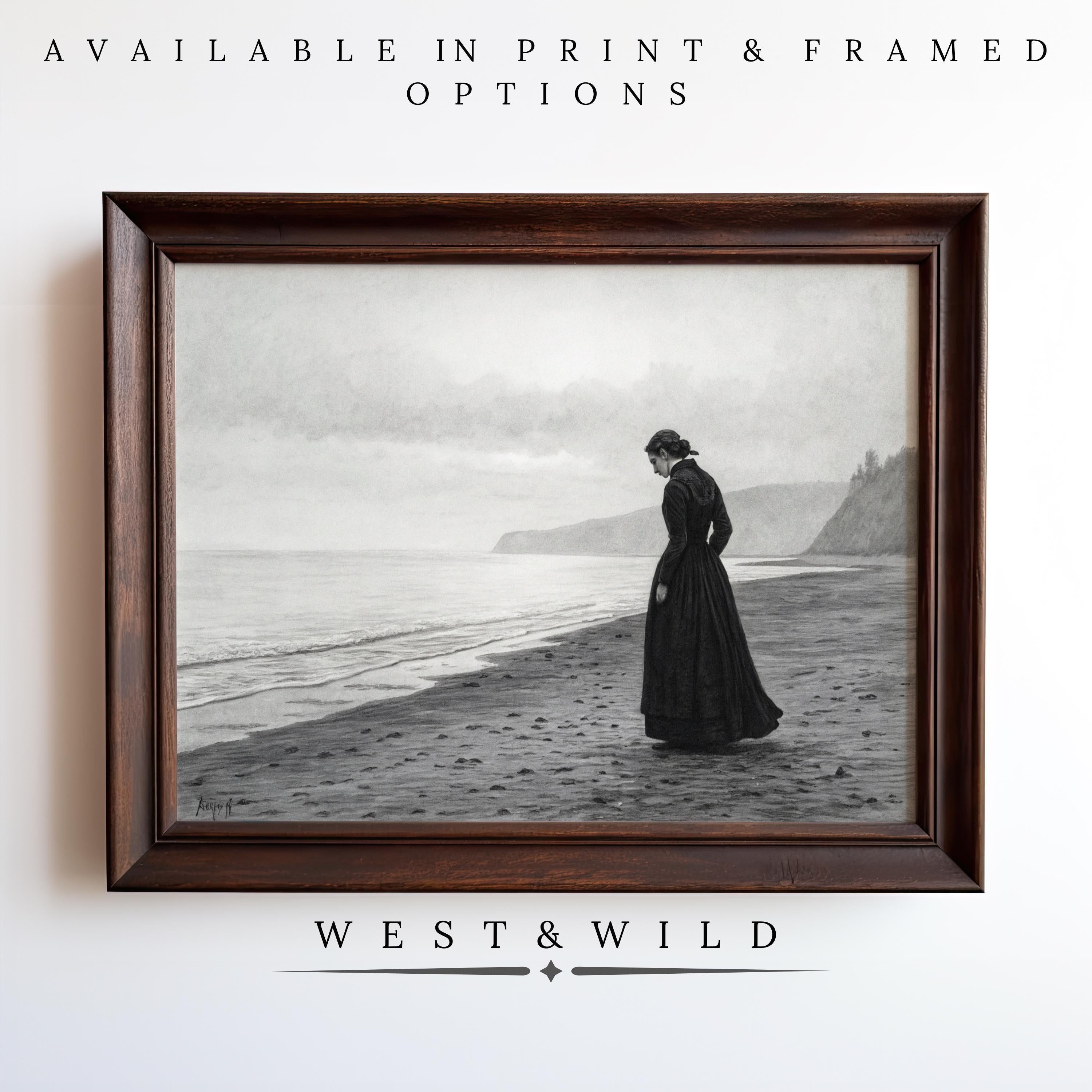 A black-and-white Vintage Moody Wall Art print features a Victorian-era woman alone on a beach with cliffs and waves. Available as Vintage Art Prints or Framed Art from the West & Wild Art Archive. Archival quality.