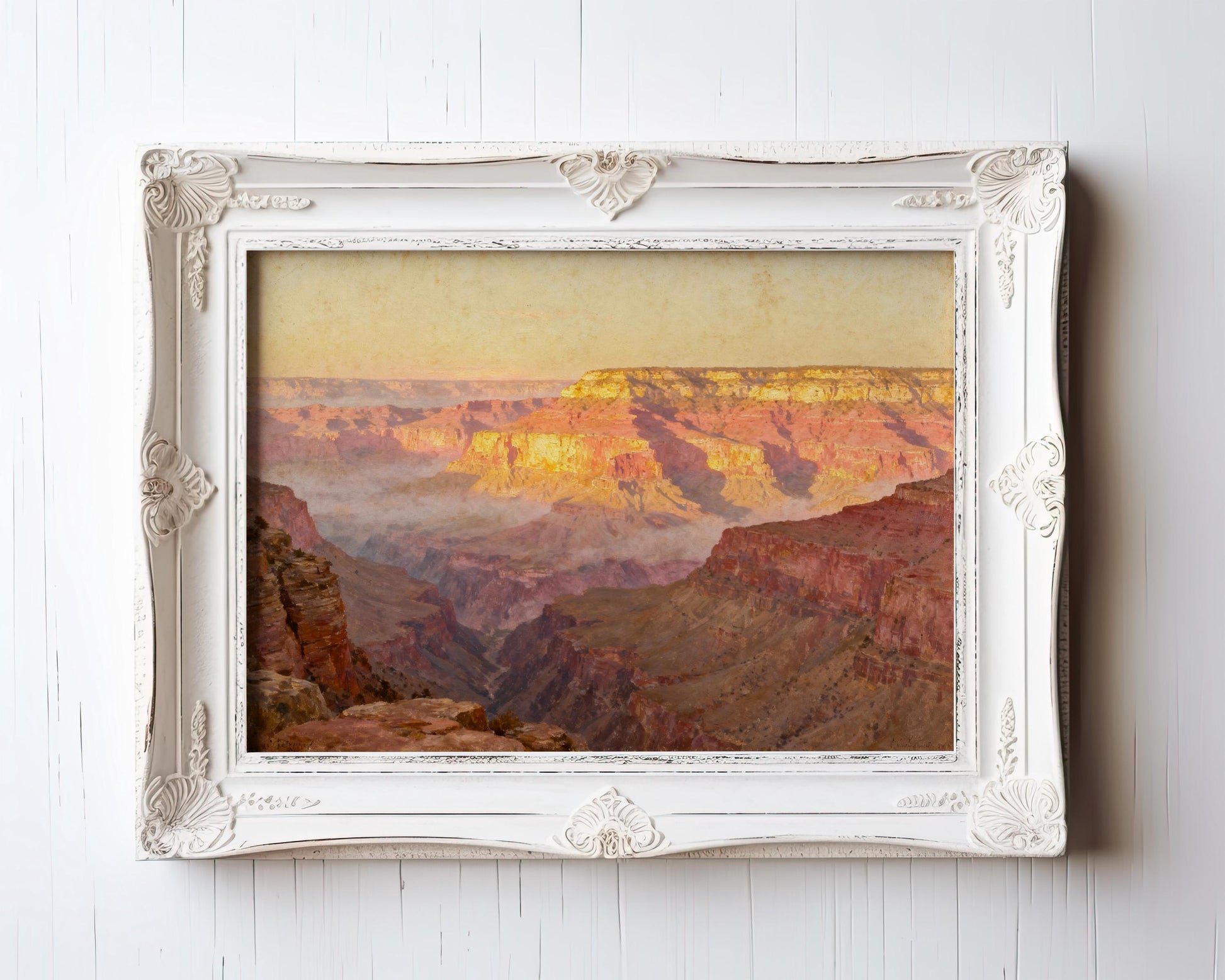 The image is a framed painting depicting a scenic view of the Grand Canyon, with the canyon's vibrant colors and dramatic landscape visible.