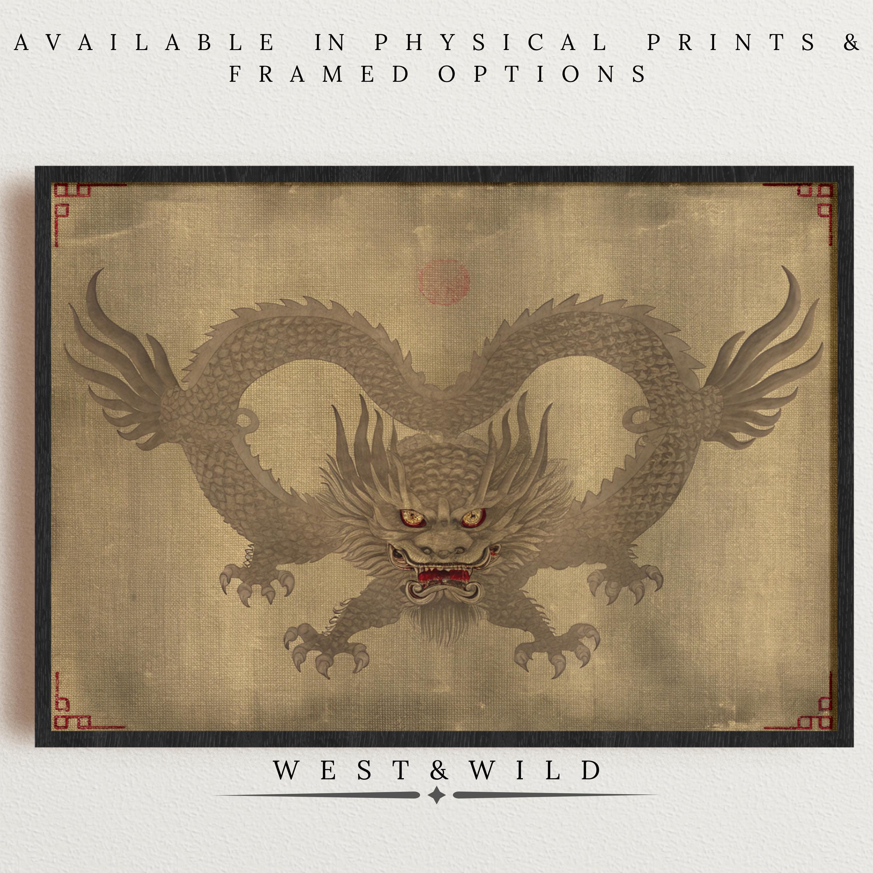 The Asian Dragon Art Print – Framed Wall Art features a traditional dragon with fierce red eyes and an ornate border, showcased on a neutral wall. Text promotes physical prints and framing by West & Wild.