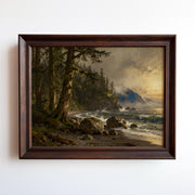 The image is a framed painting depicting a serene coastal landscape with a rocky shore, lush trees, and a body of water with waves crashing against the shore.