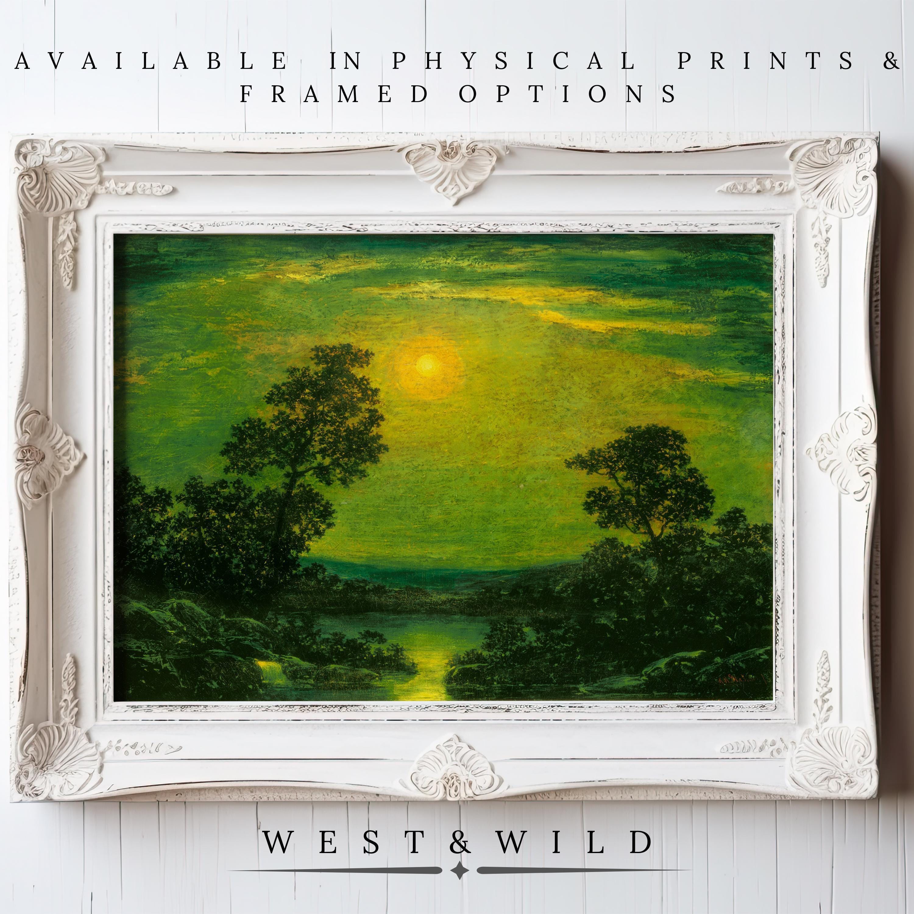 A framed Vintage Green Wall Art print showcases a vivid green landscape with trees and a river at sunrise or sunset in an ornate white frame. Features archival quality; "West & Wild Art Archive" appears below. Ideal for Victorian home décor.