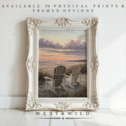 An ornate white frame holds a beach sunset painting of two empty chairs facing the ocean, leaning against a white wall. Beach Sunset Painting – Coastal Wall Art with framing options available from WEST&WILD.