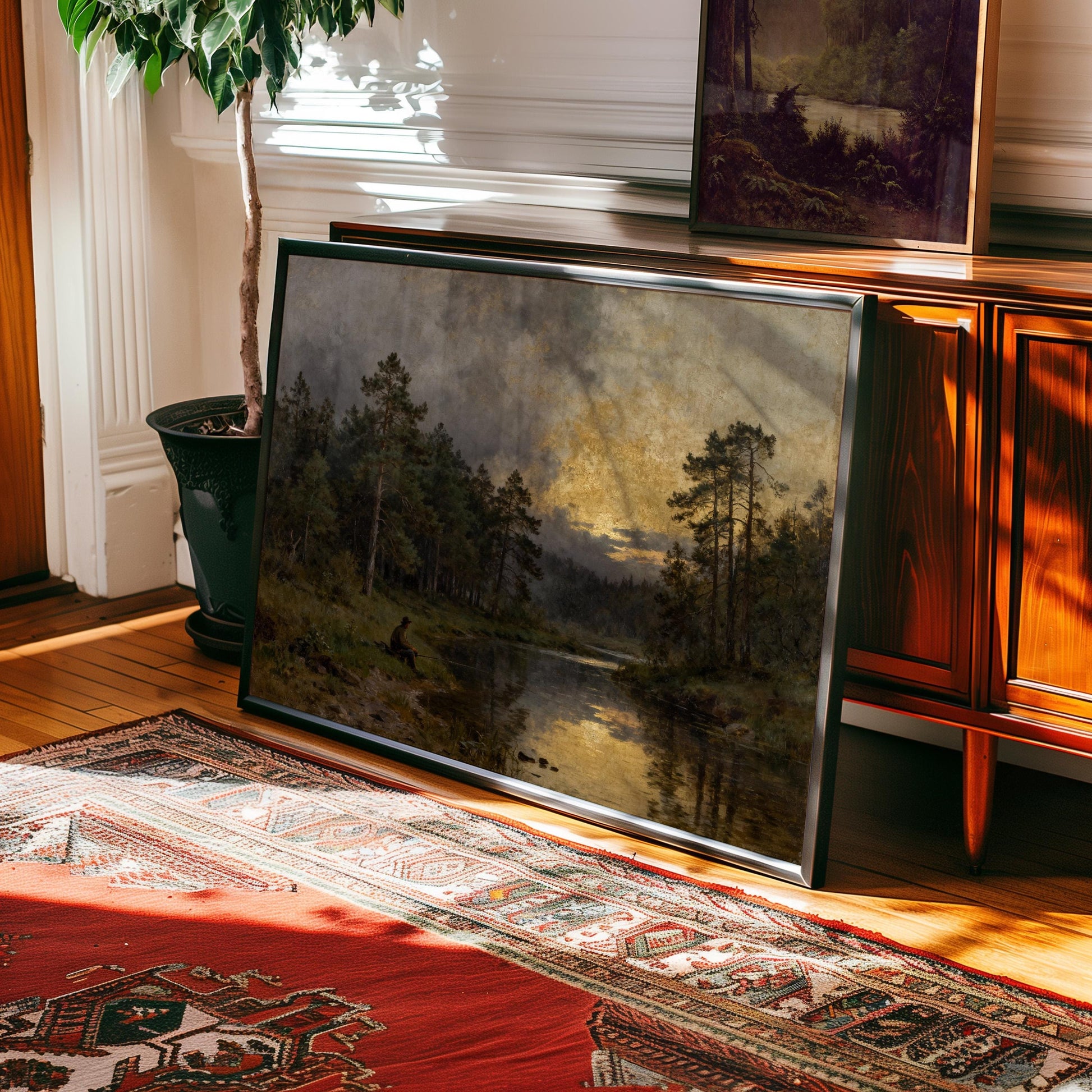 a large landscape painting depicting a serene forest scene with a lake in the background, hanging on a wall in a room with a wooden cabinet and a rug.