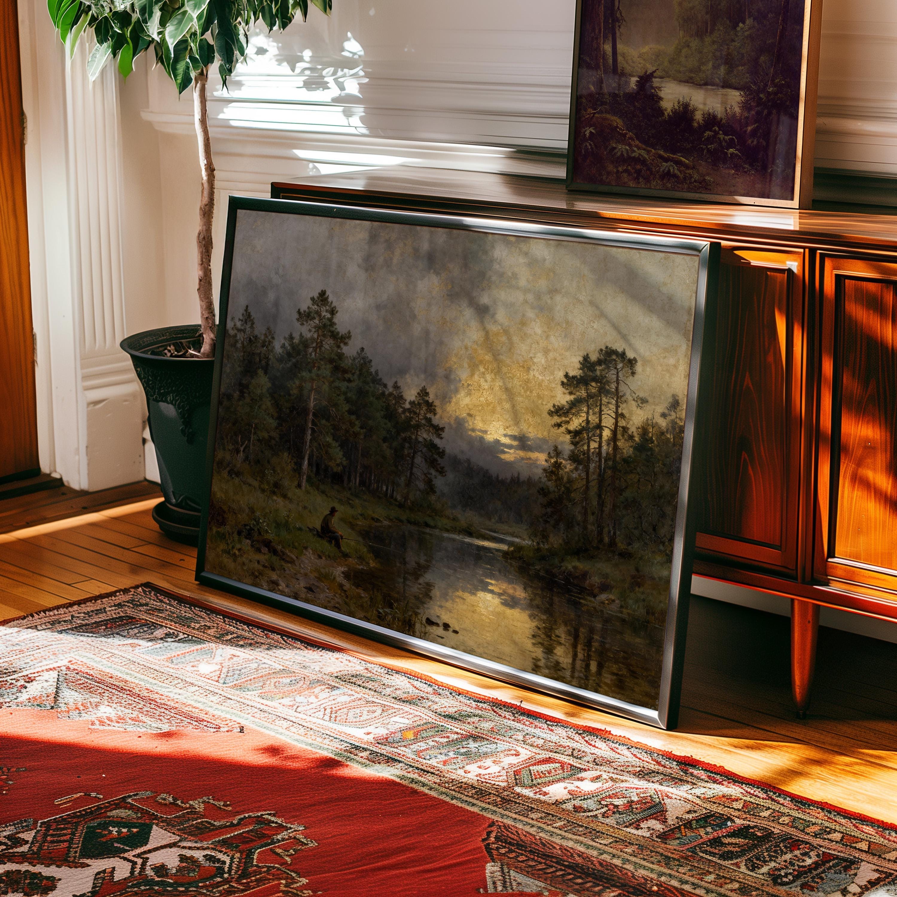 a large landscape painting depicting a serene forest scene with a lake in the background, hanging on a wall in a room with a wooden cabinet and a rug.
