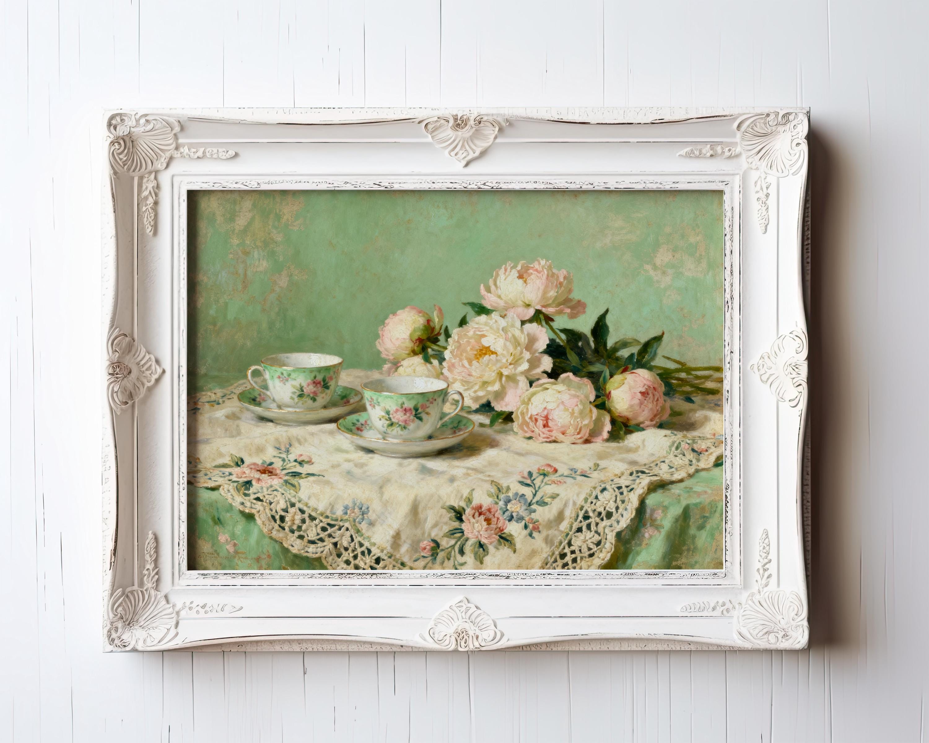 A framed painting depicting a table with two teacups and a bouquet of pink peonies.