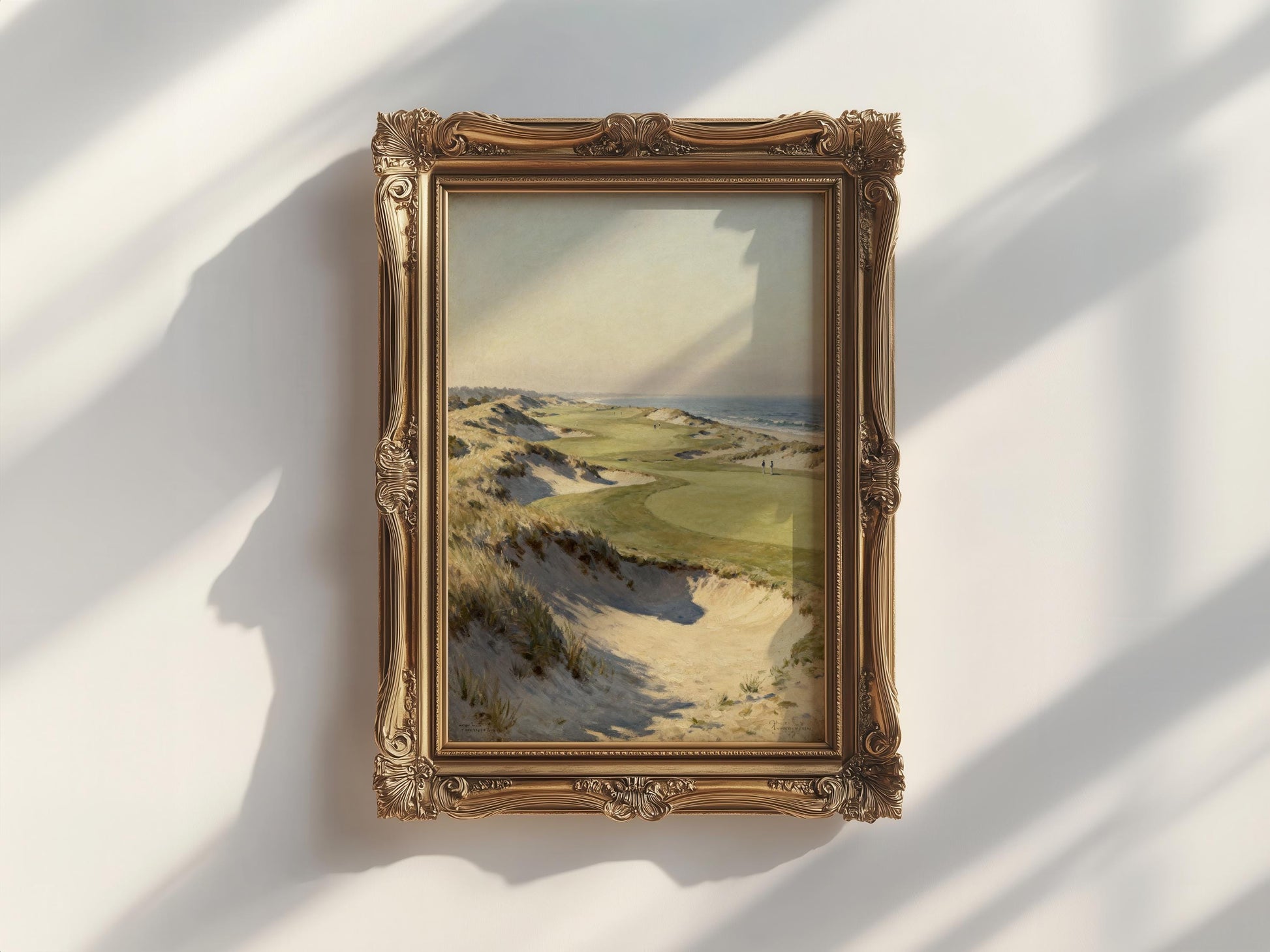 a painting of a landscape with a field and hills in the background, hanging on a wall.