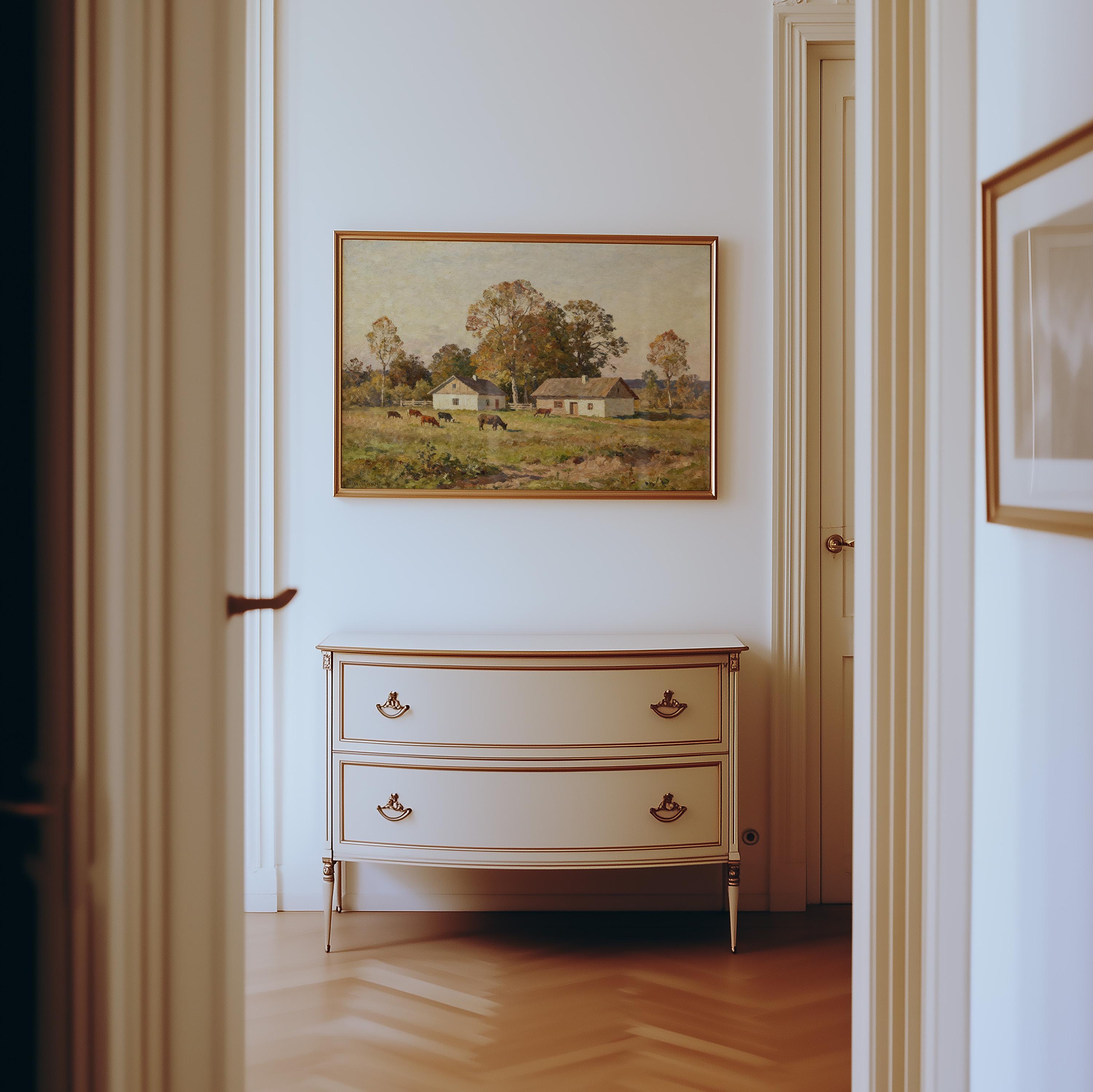 A hallway with light wooden floors, white walls, a cream dresser with brass handles, and the Country Homestead Art Print – Vintage Pastoral Wall Decor with Rustic Farmhouse Charm from West & Wild Art Archive hanging above it.