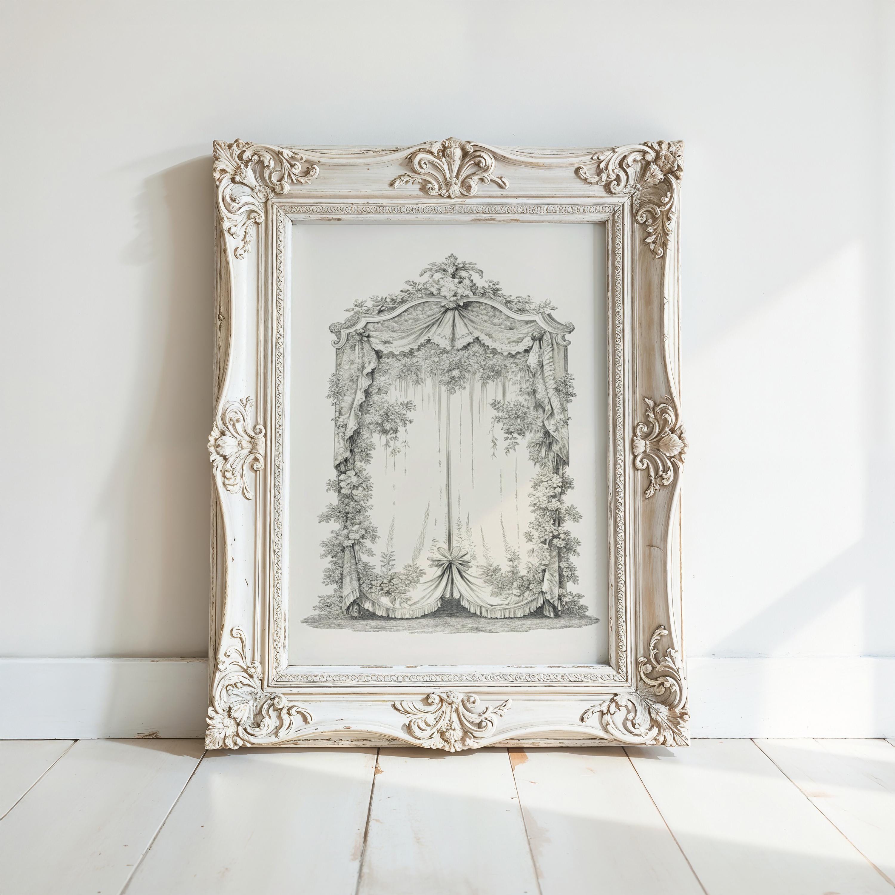 A white ornate frame with a decorative border is displayed on a white wooden floor against a white wall.