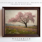 Discover the Cherry Blossom Wall Art – Vintage Floral Prints, featuring a blooming pink cherry blossom tree in a wildflower field. Shop archival quality prints and framed options from the West & Wild Art Archive.