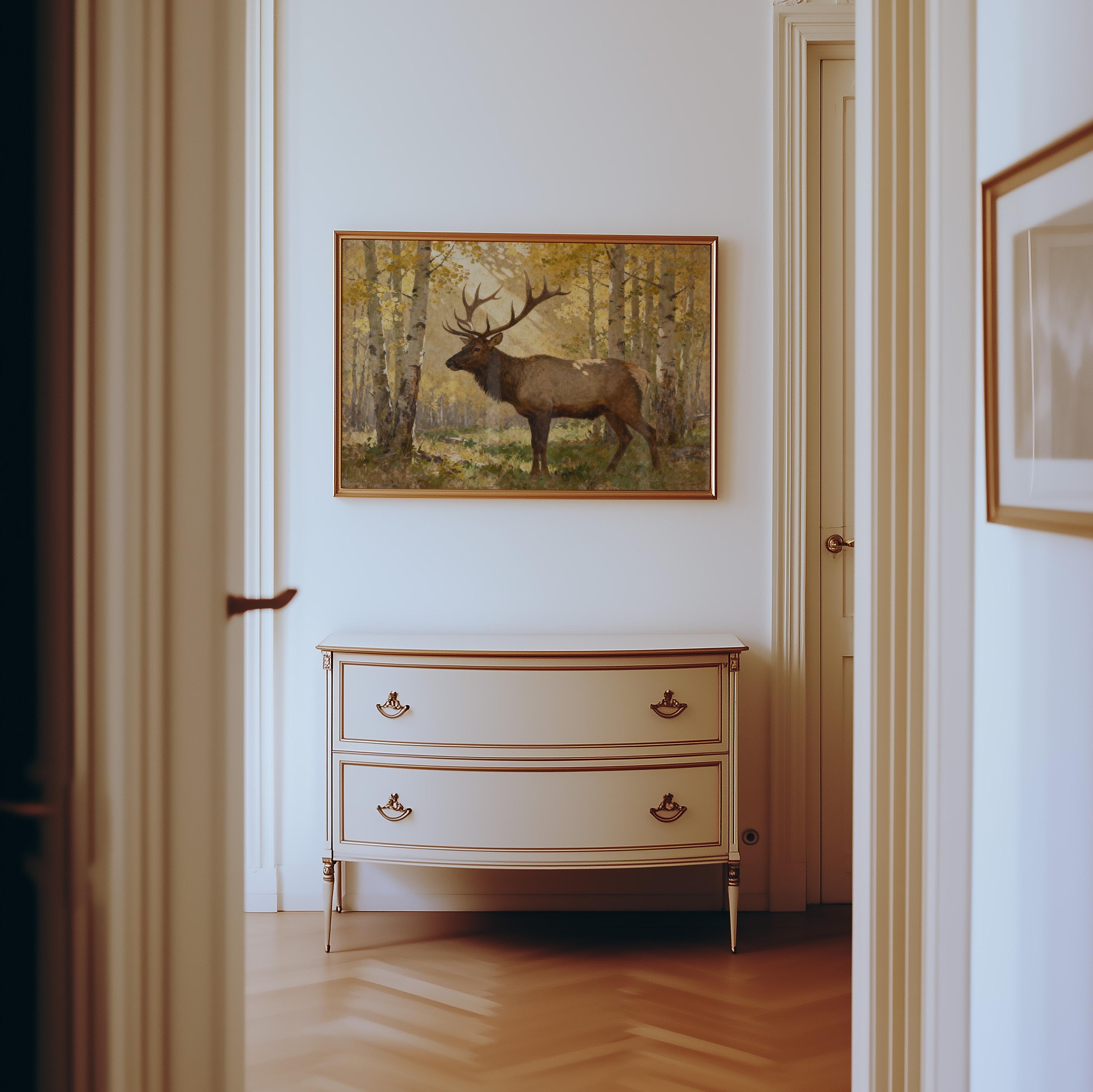 a hallway with a framed painting of a deer standing in a forest setting. The painting is hanging on the wall above a white dresser with two drawers. The hallway has a wooden floor and white walls, creating a clean and elegant atmosphere.