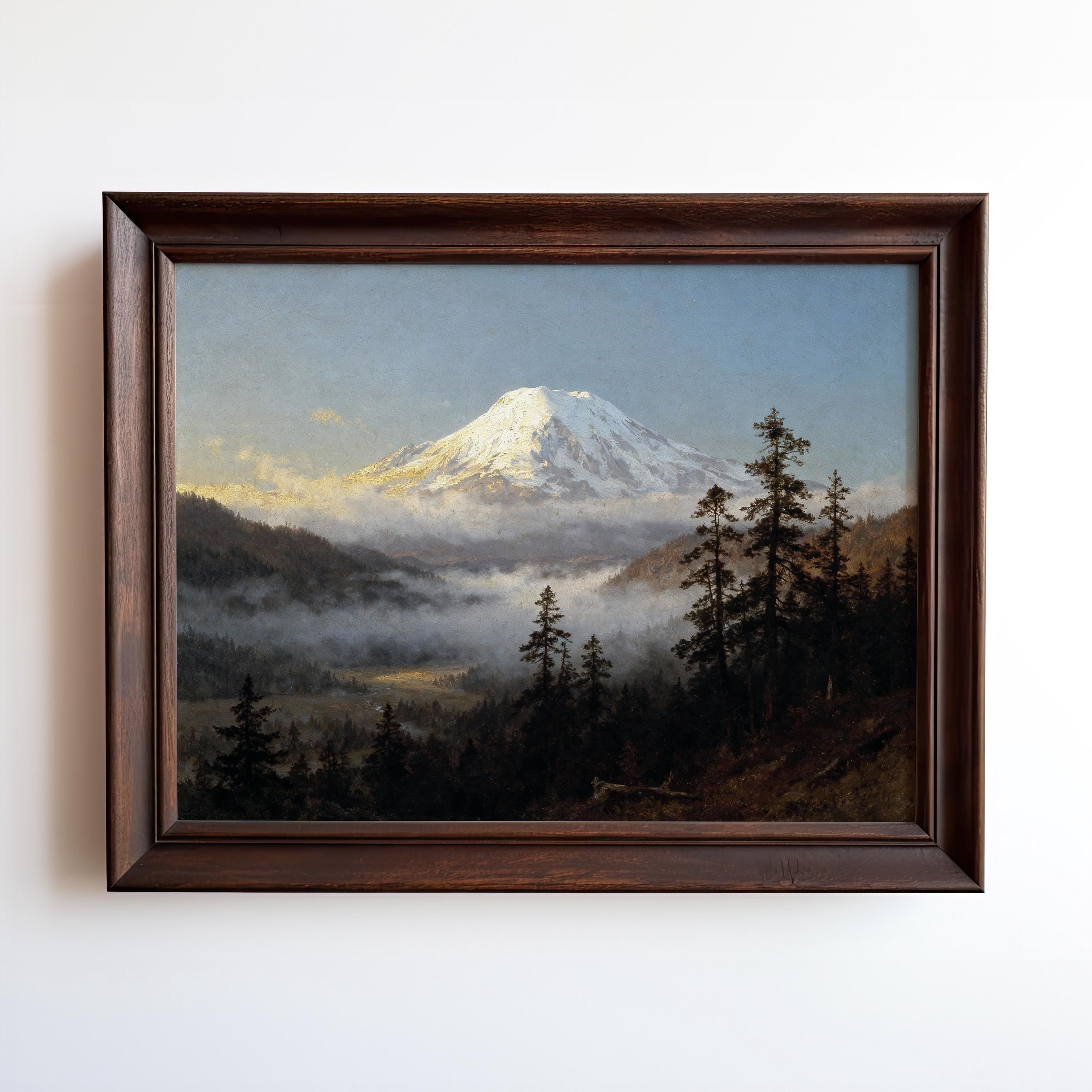 The image is a framed painting depicting a majestic mountain landscape with a snow-capped peak, surrounded by a forest of pine trees and a misty, hazy atmosphere.