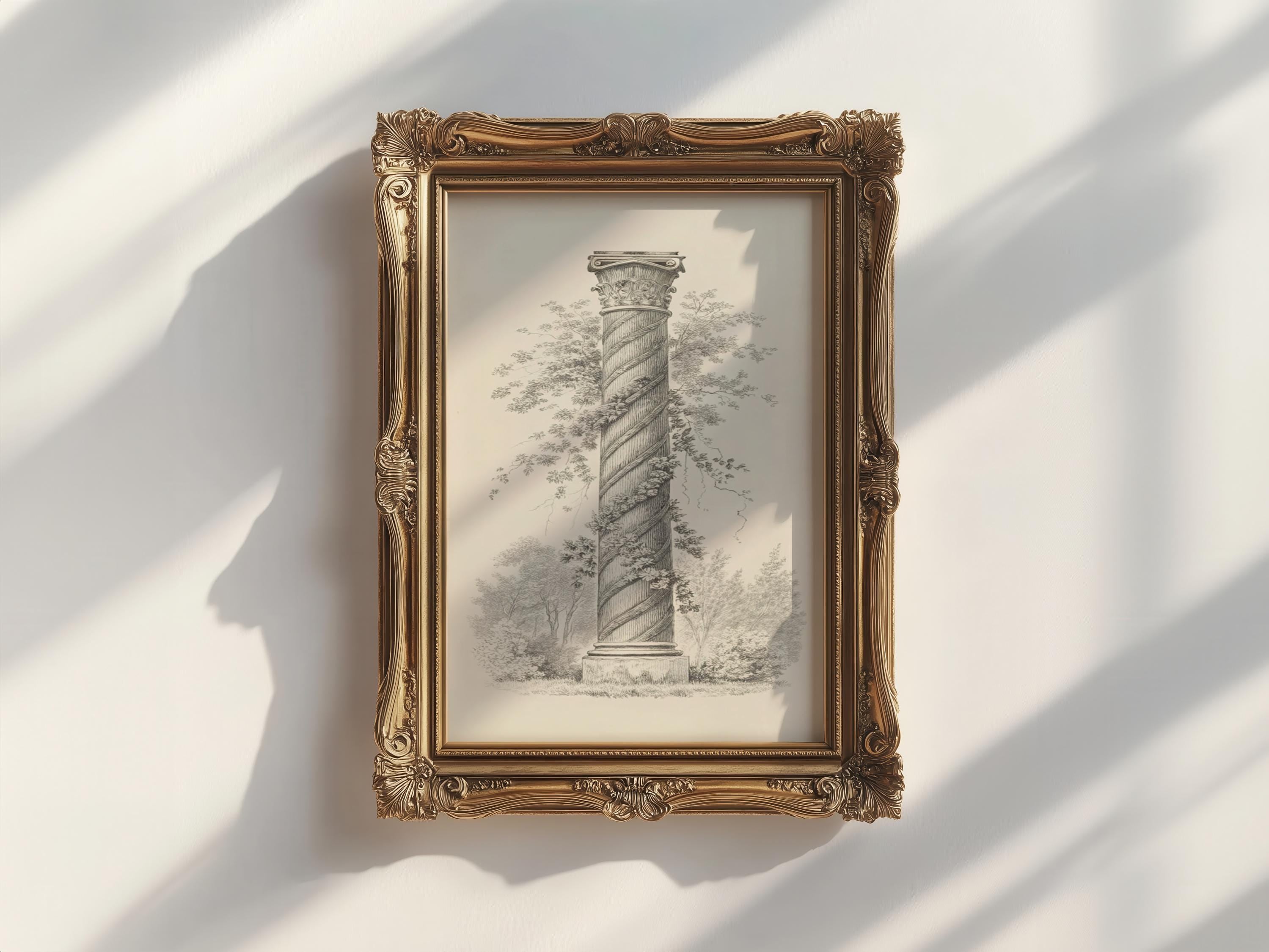 a tall, ornate column with a decorative frame, which is hanging on a white wall.