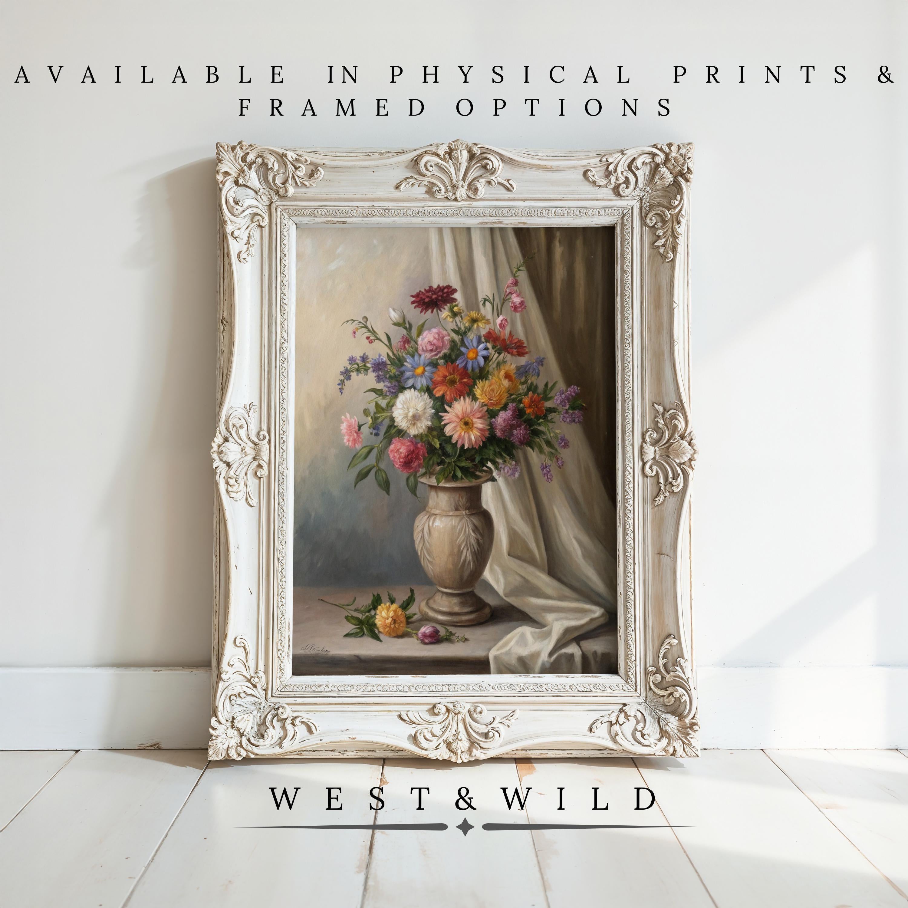 A framed Floral Watercolor Painting – Vintage Botanical Decor with muted flowers stands on a white wood floor against a white wall. Available as archival quality prints & framed art. Brand: West & Wild.
