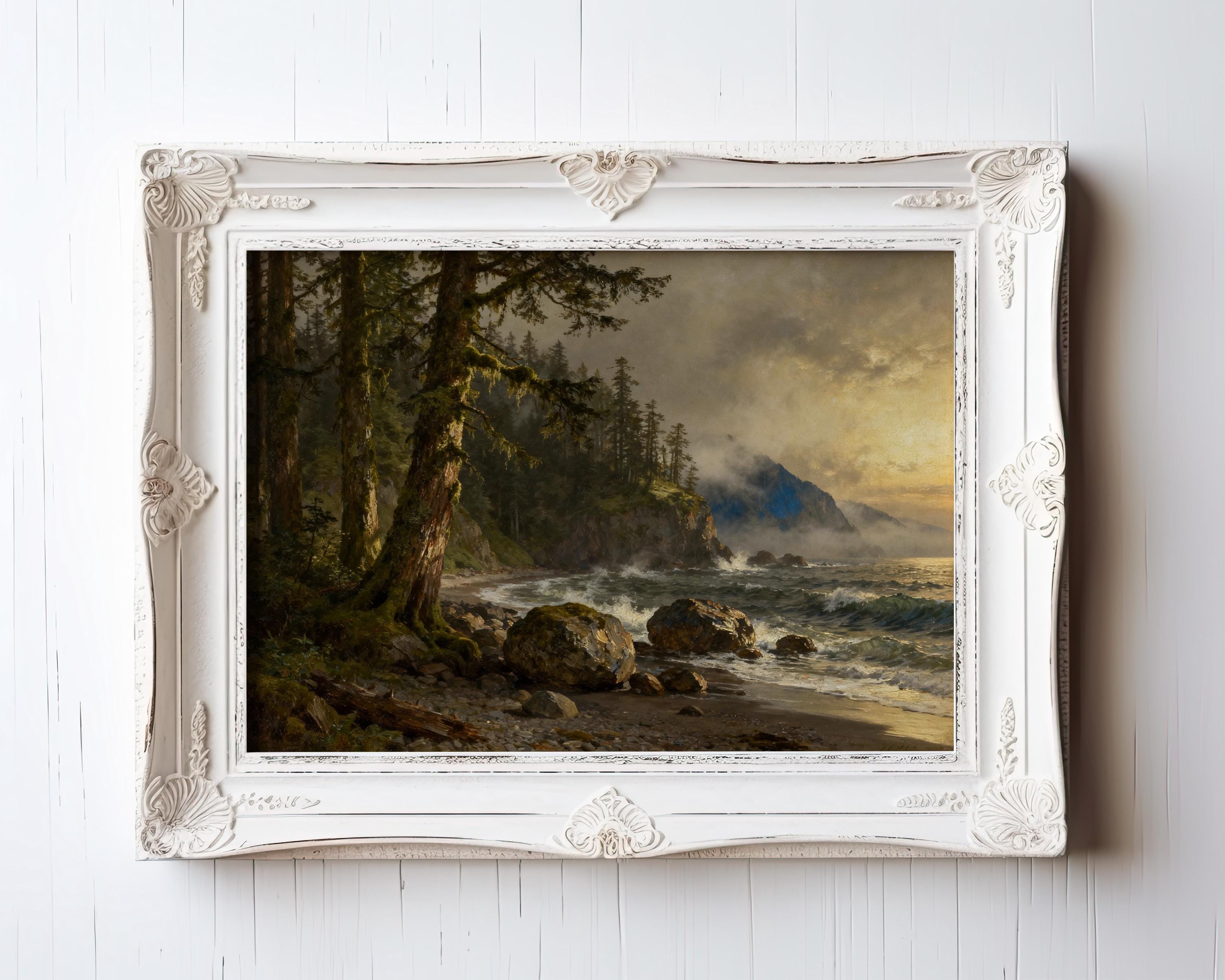 The image is a framed painting depicting a serene coastal landscape with a rocky shore, lush trees, and a body of water with waves crashing against the shore.