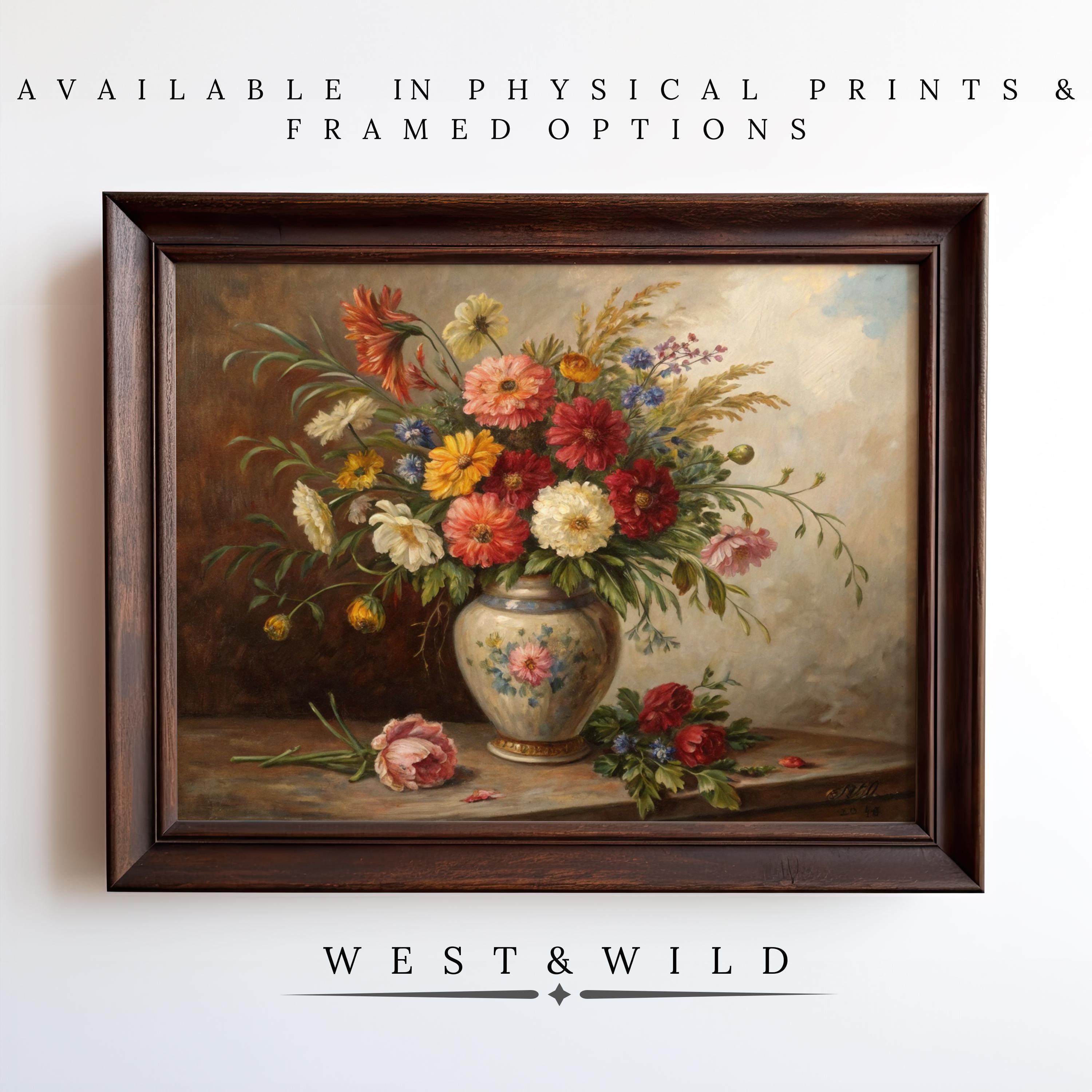 A Victorian Floral Painting – Antique Botanical Art print featuring a muted watercolor floral arrangement in a vase sits against a white wall; text reads, “Available in physical prints & framed options” and “West & Wild Art Archive.”.