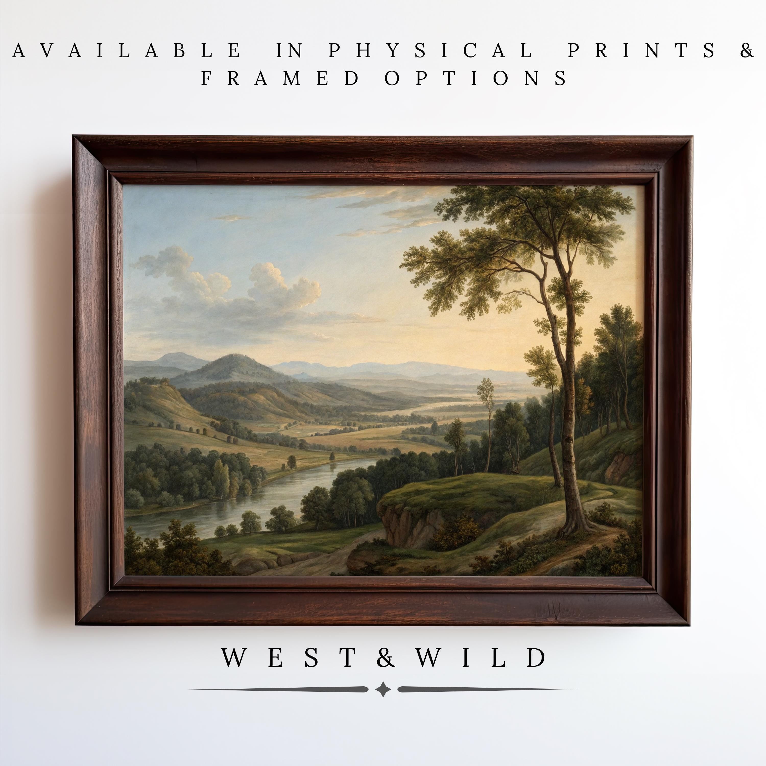 A framed Serene Landscape Painting – Classic American Scenery Art With Framed Meadow Prints is displayed on a white wall. Text above and below reads: “Available as vintage art prints & framed art – West & Wild Art Archive.”.