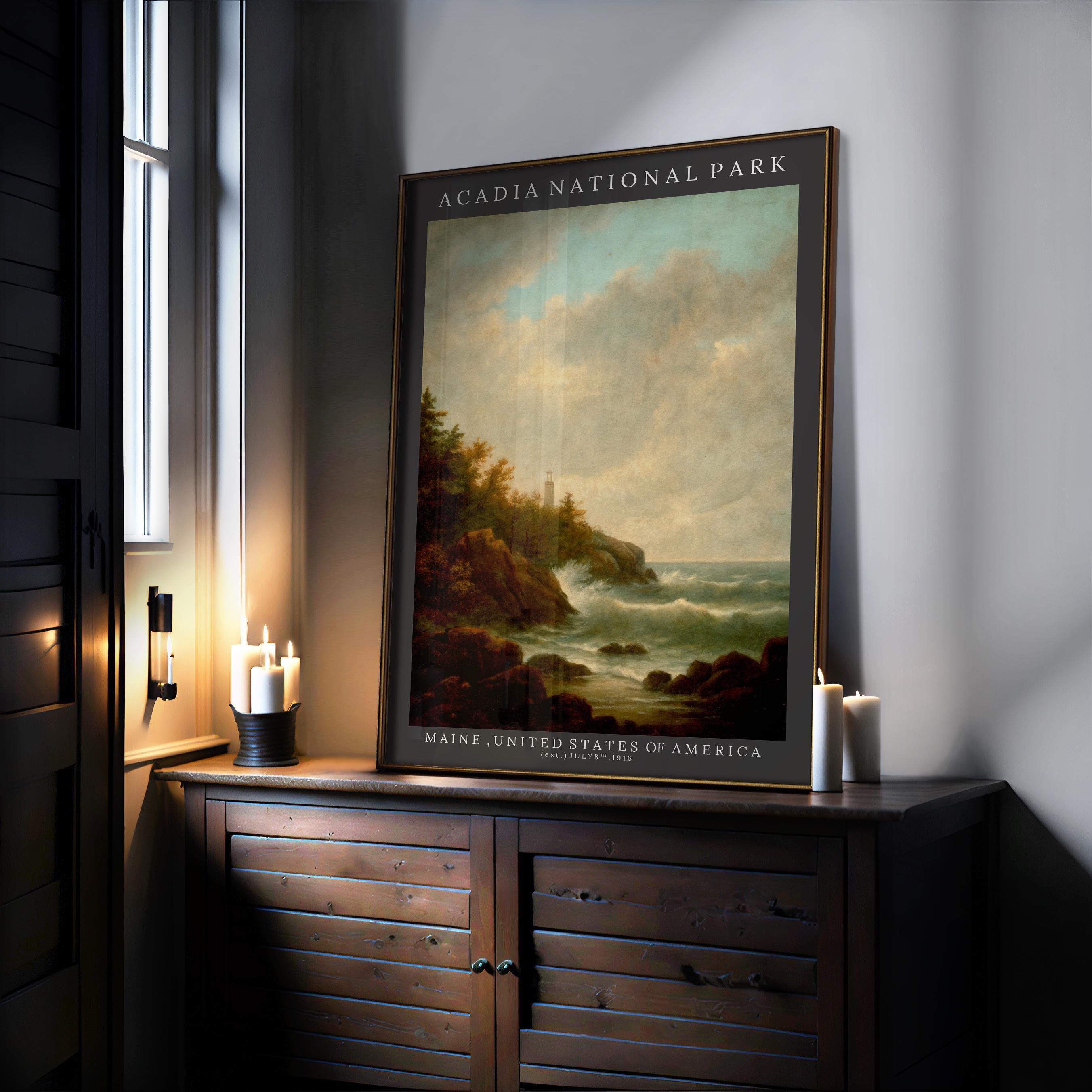 An Acadia National Park Poster – Vintage Coastal Park Print with Pine Forest Illustration rests framed on a wooden cabinet beside lit candles, adding classic charm to a softly lit room.
