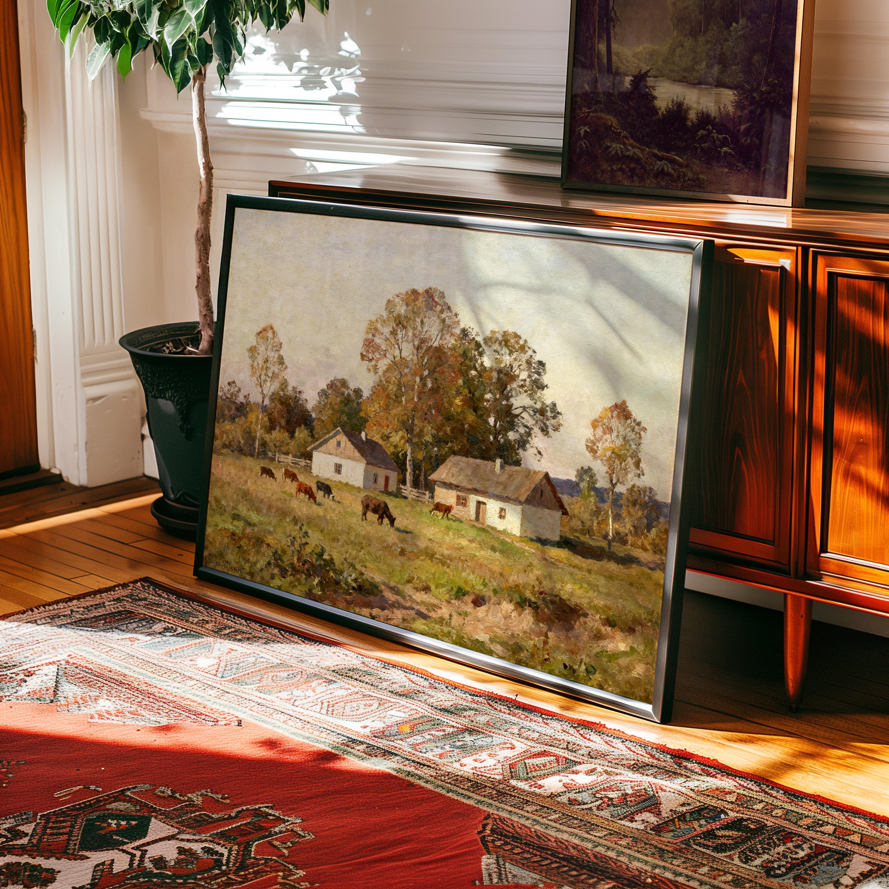 The Country Homestead Art Print – Vintage Pastoral Wall Decor with Rustic Farmhouse Charm rests against a wooden cabinet on a patterned rug in a sunlit room, beside a potted plant and another West & Wild Art Archive framed print.