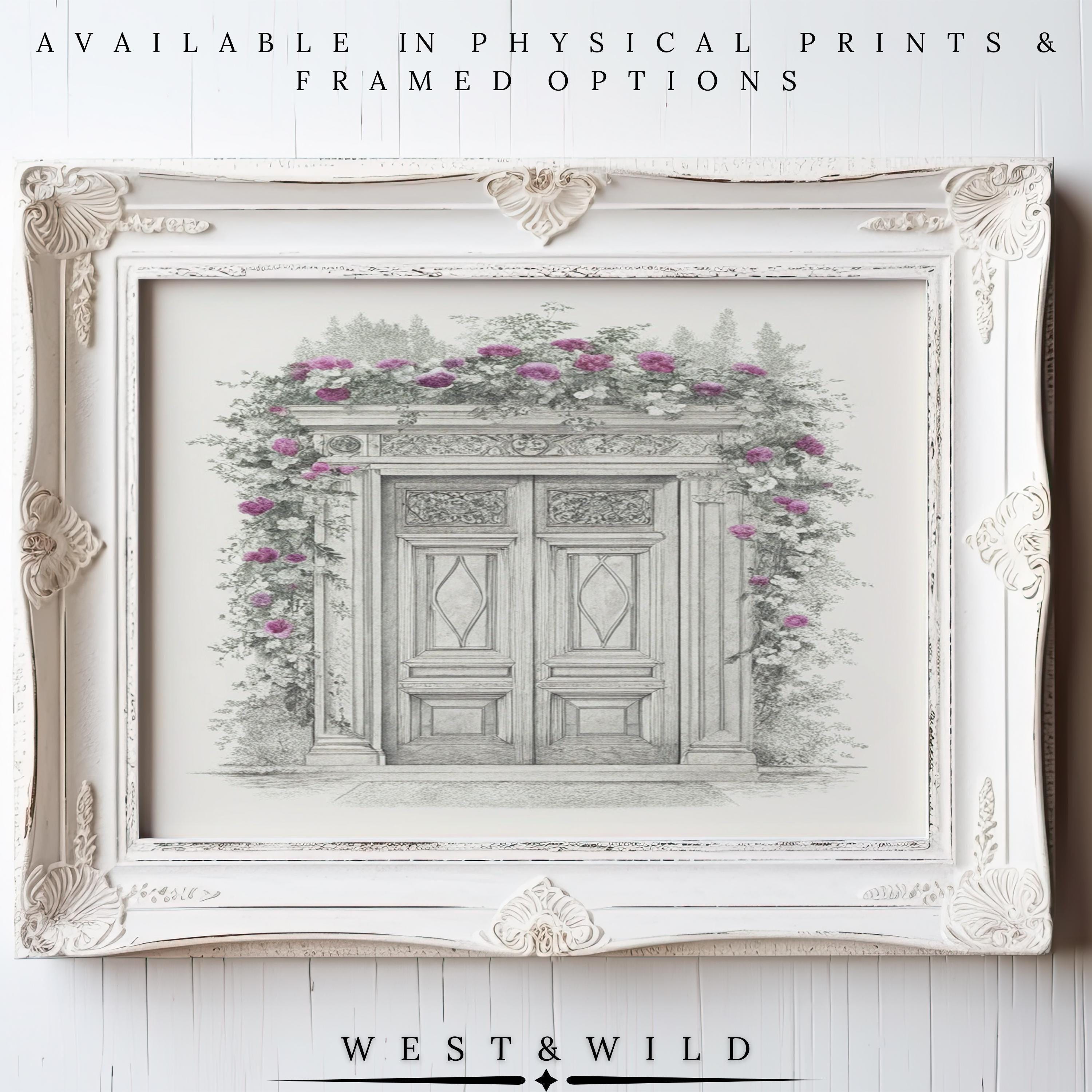 A vintage-style white frame displays the “European Doorway Wall Art – Vintage Architectural Print With Framed Botanical Sketch,” featuring double doors with pink climbing roses. Available as archival quality prints & framed art by West & Wild.