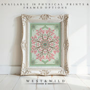 A vintage-style frame displays the Cherry Blossom Wall Art – Victorian Floral Painting with pink blossoms and green accents, set against a white wall and wooden floor. Available as archival quality prints & framed art. Below: West & Wild.