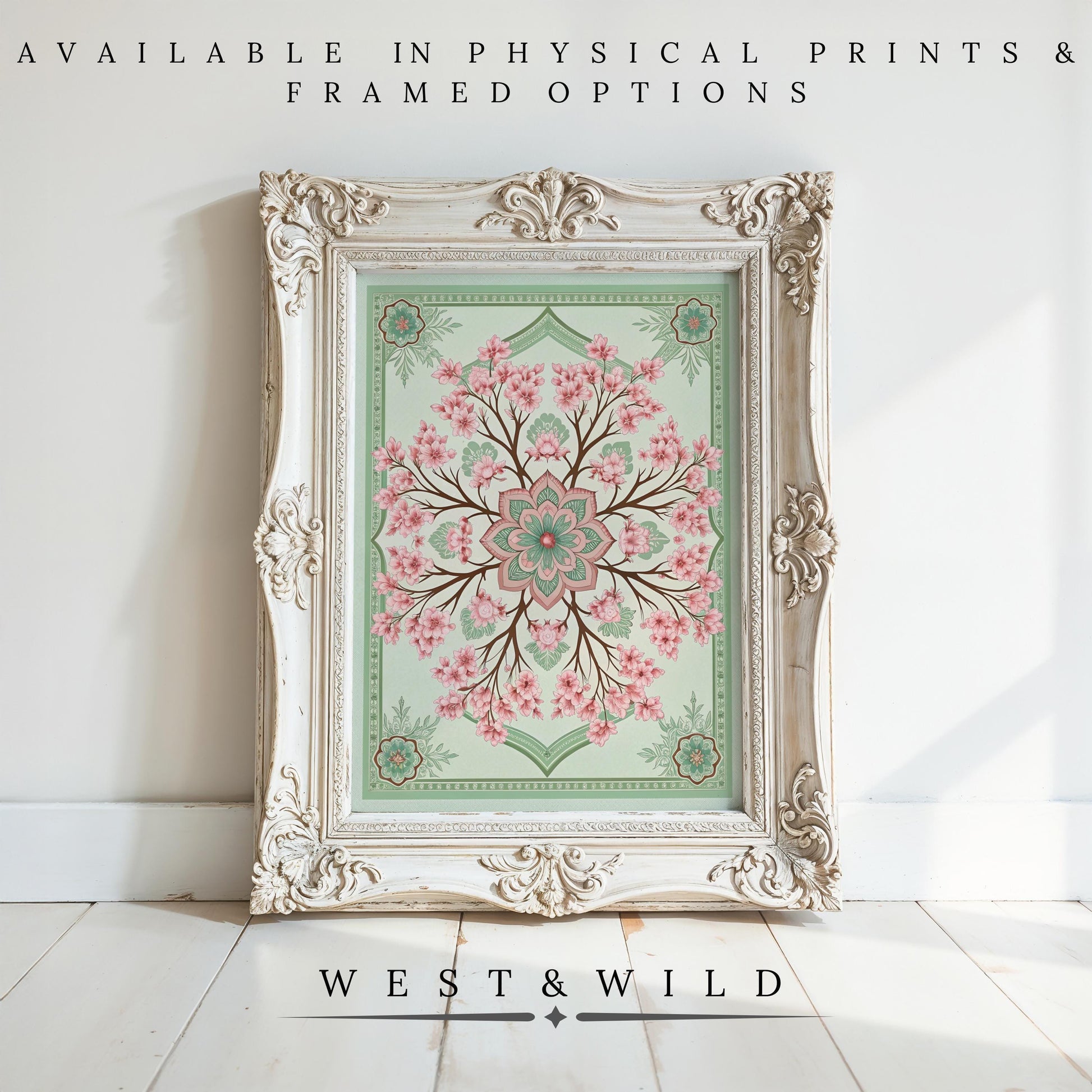 A vintage-style frame displays the Cherry Blossom Wall Art – Victorian Floral Painting with pink blossoms and green accents, set against a white wall and wooden floor. Available as archival quality prints & framed art. Below: West & Wild.