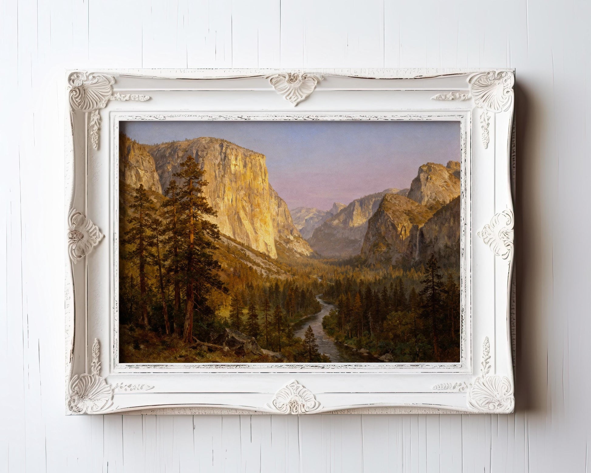The image is a framed painting depicting a scenic mountain landscape with a winding river and lush forests.
