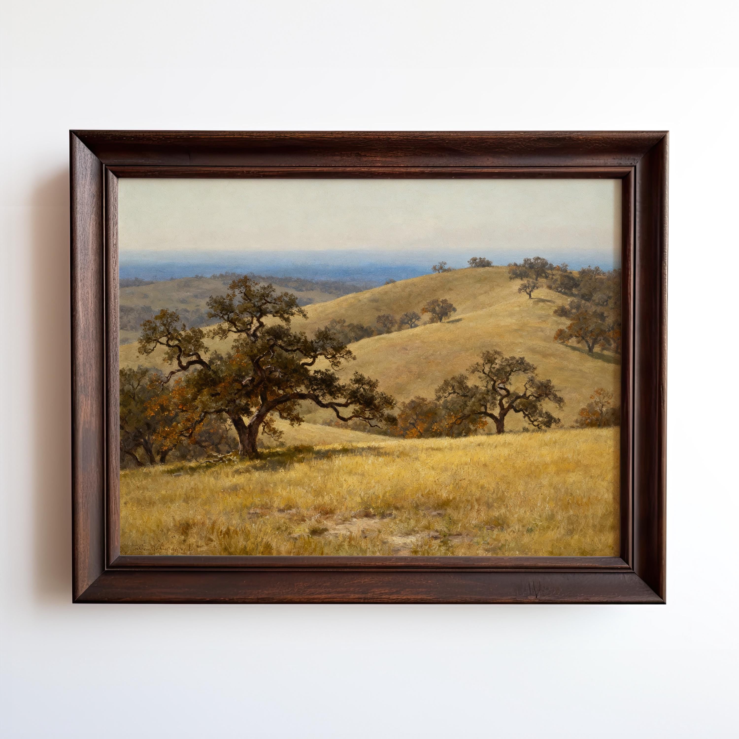 The image is a framed painting depicting a serene landscape with rolling hills, lush trees, and a clear blue sky.