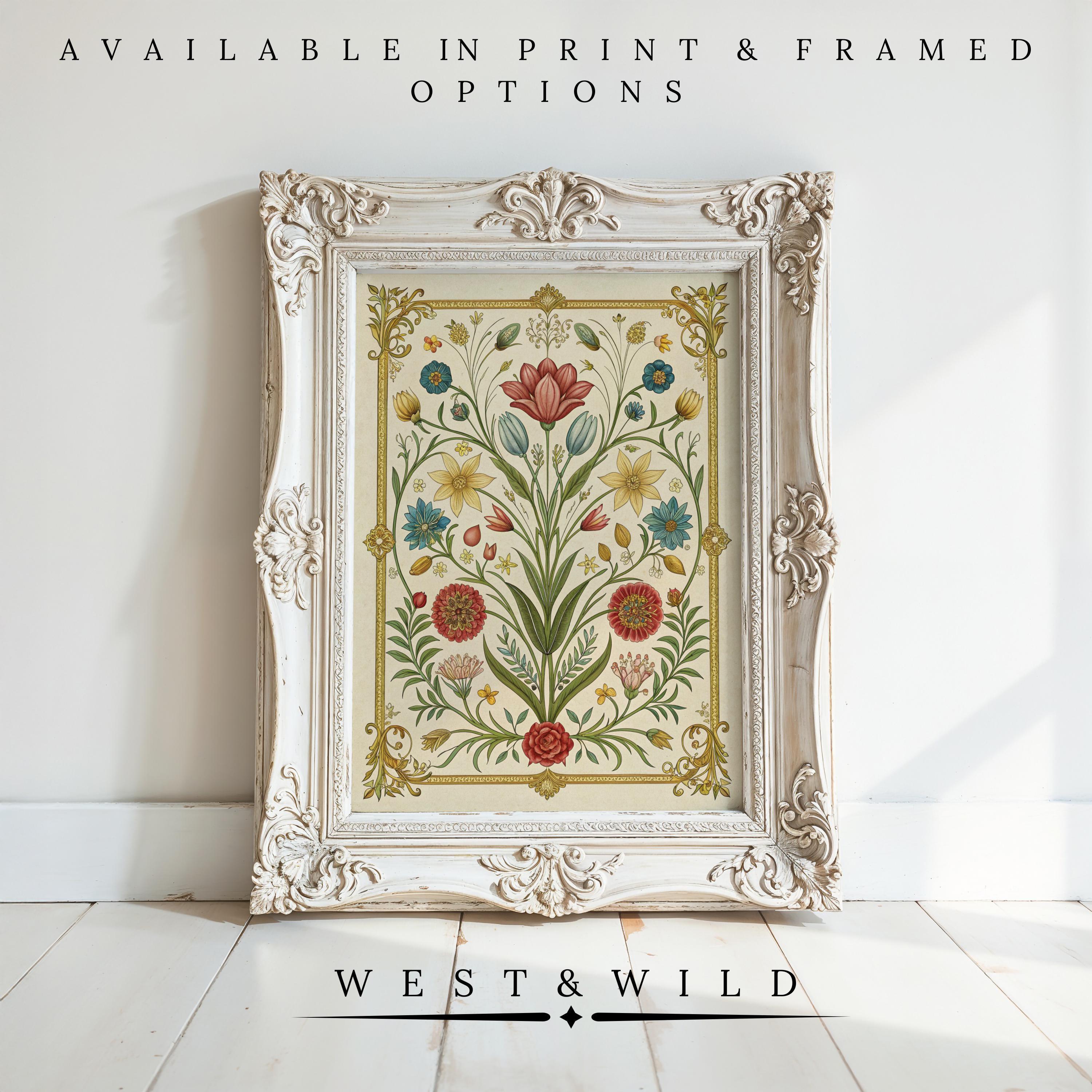The Vintage Floral Prints – Botanical Wall Art features red, blue, and yellow flowers in a white vintage frame, resting on a light wood floor. Available as print or framed; West & Wild—charming farmhouse decor for your space.