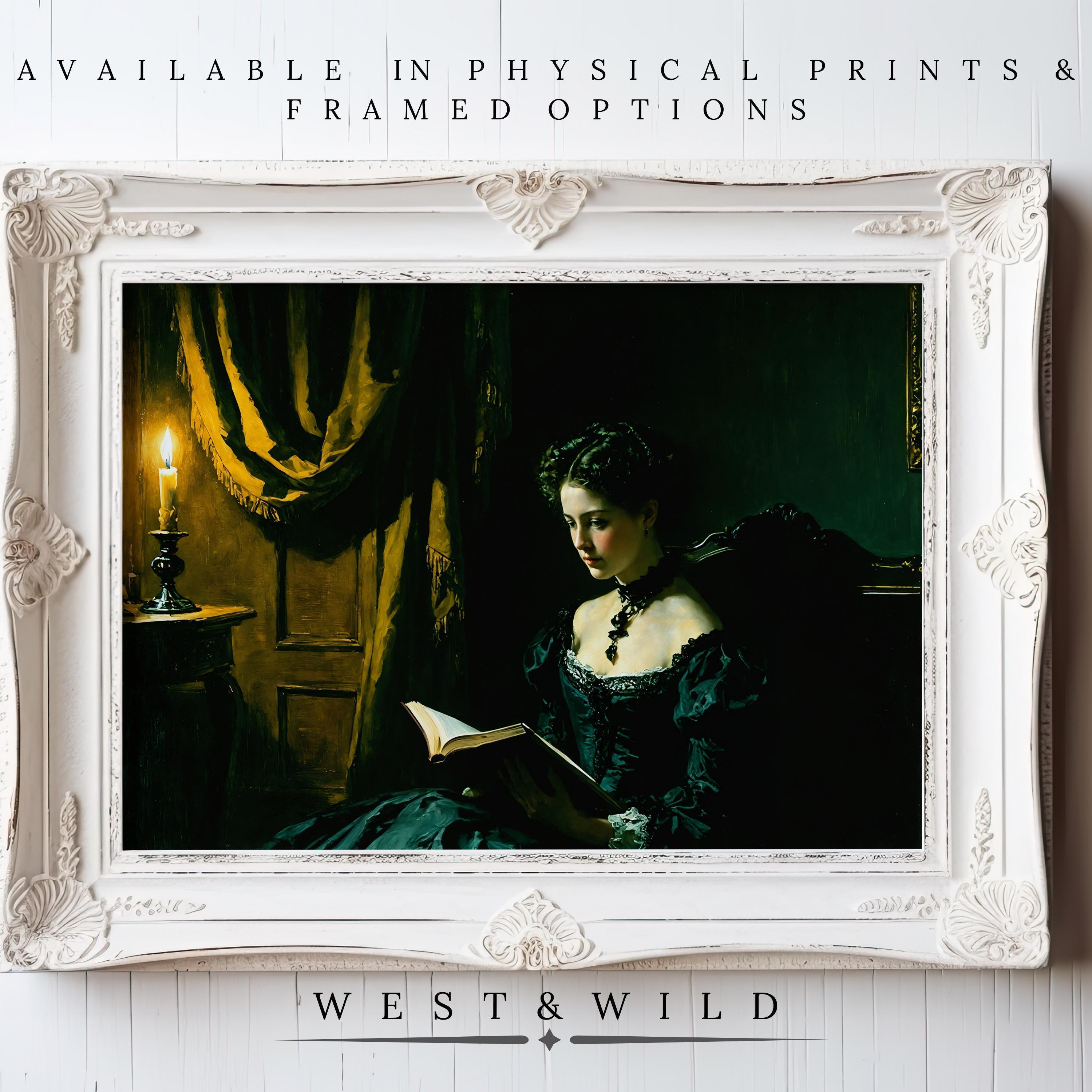 A framed “Gothic Victorian Art Print” depicting a woman in a black dress reading by candlelight is displayed on a white wooden wall. Available as vintage art prints & framed art from West & Wild Art Archive.