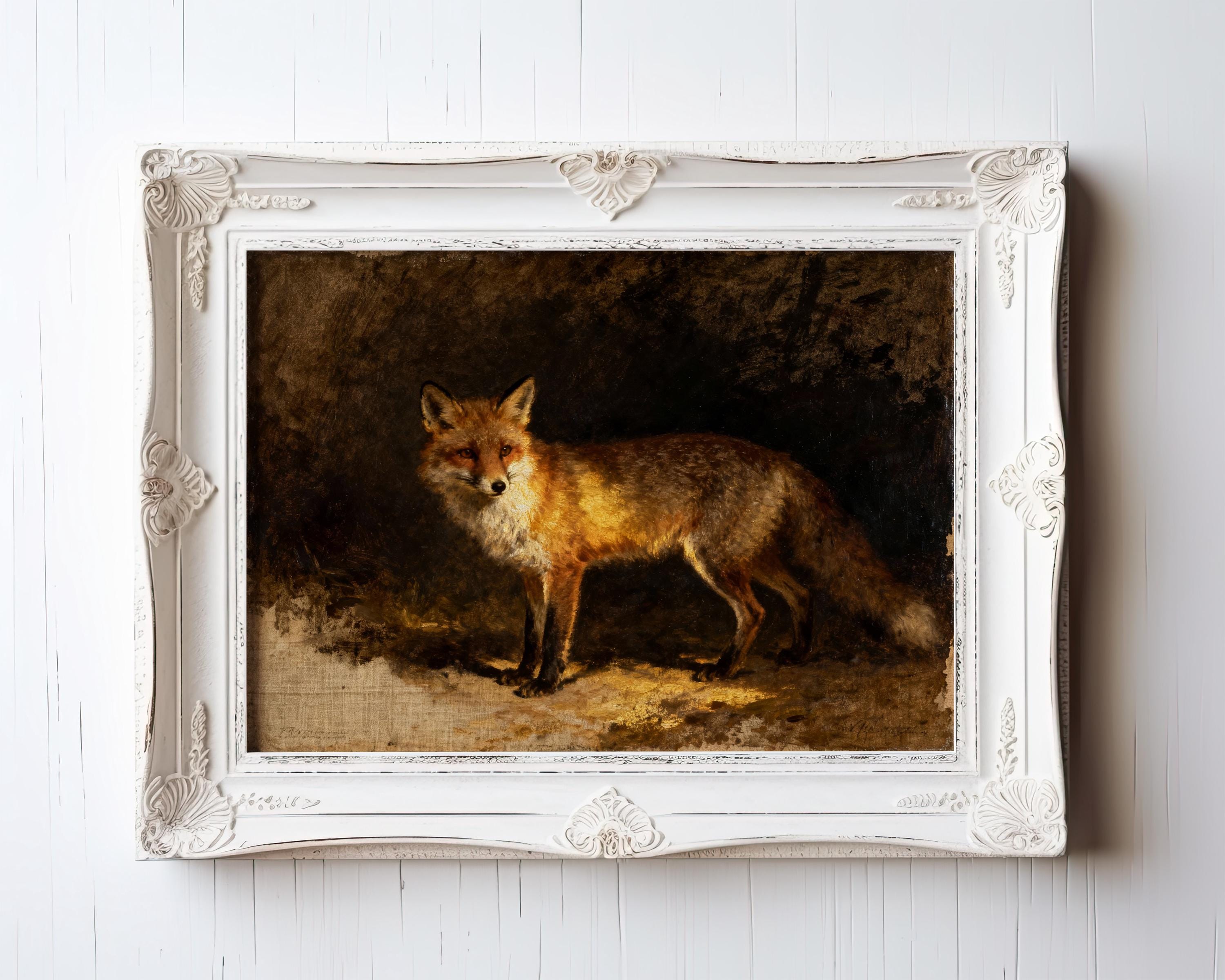 The Vintage Wildlife Art Print – Red Fox Wall Art features a striking fox on a dark background, set in an ornate white frame against a white wooden wall—perfect as a rustic home decor accent.