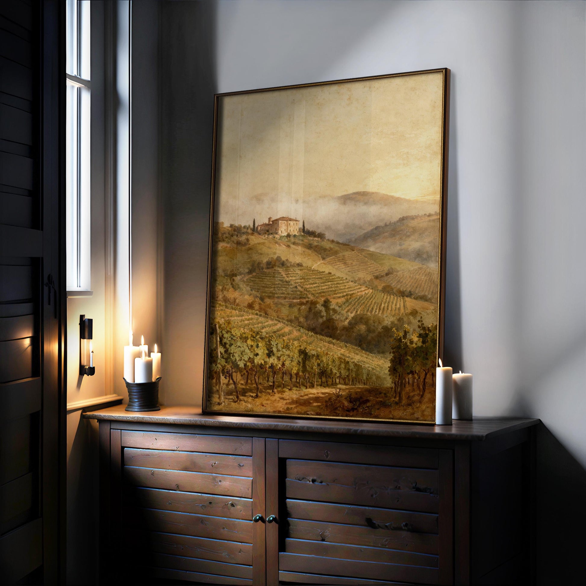 a large painting of a countryside landscape, with a house and trees in the background, displayed on a wooden cabinet or shelf.