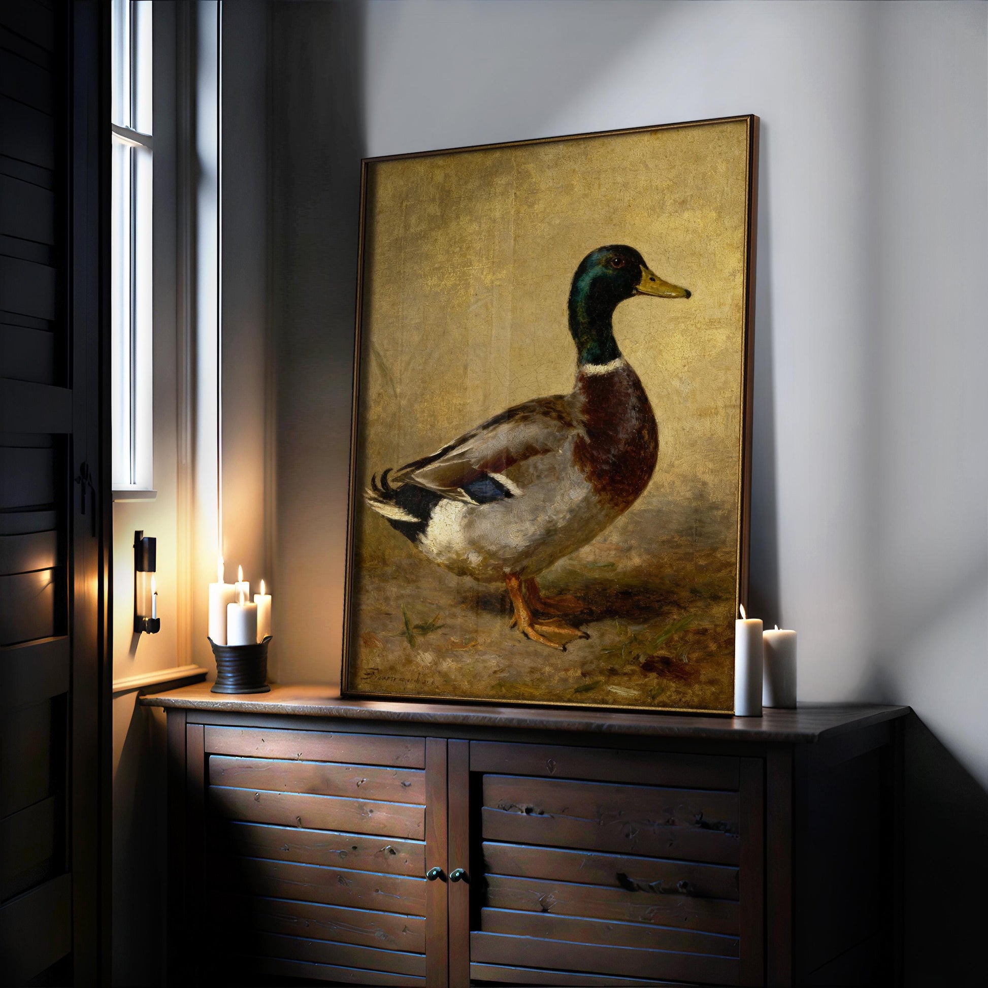 a large painting of a duck on a wooden cabinet, with candles placed on the cabinet and a window nearby.