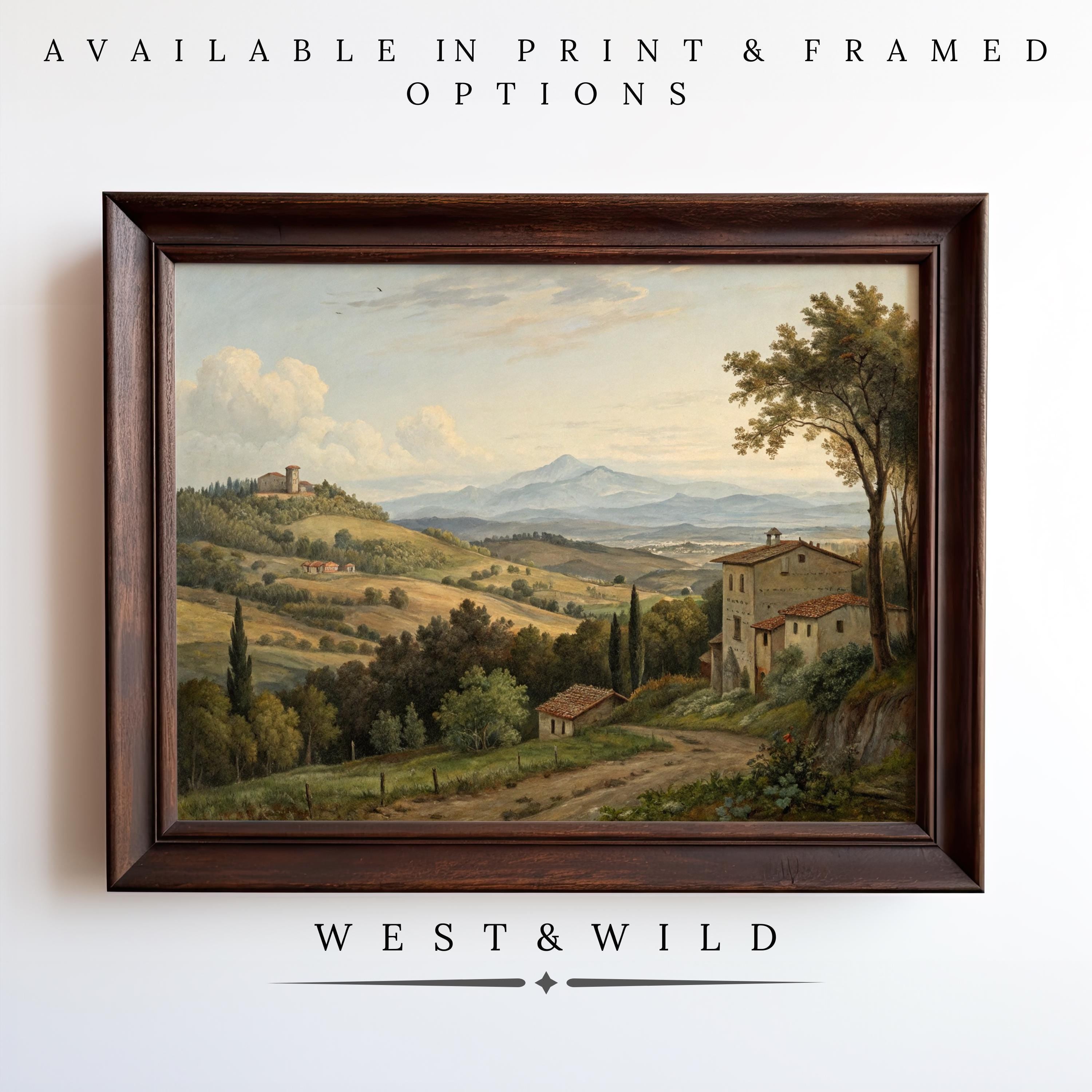 Bring rustic charm to your home with the Italian Countryside Painting—vintage-style wall art featuring hills, mountains, trees, houses, and a castle under blue skies. Available as vintage art prints or in framed options from West & Wild.