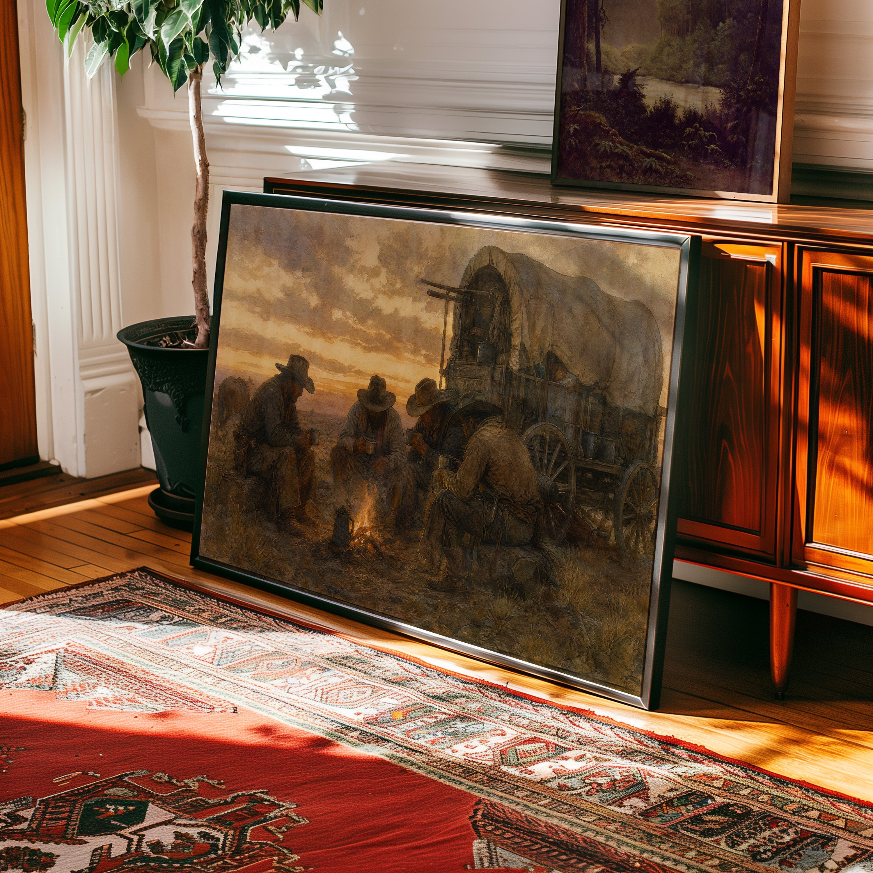 Oil painting of cowboys at campfire beside covered wagon at sunset — view 2