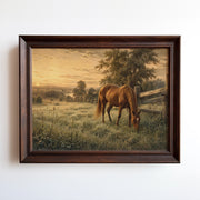 Oil painting of a chestnut horse grazing in a golden sunset meadow with wooden fence
