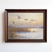 Oil painting print of geese flying over a frozen lake at golden-light dawn