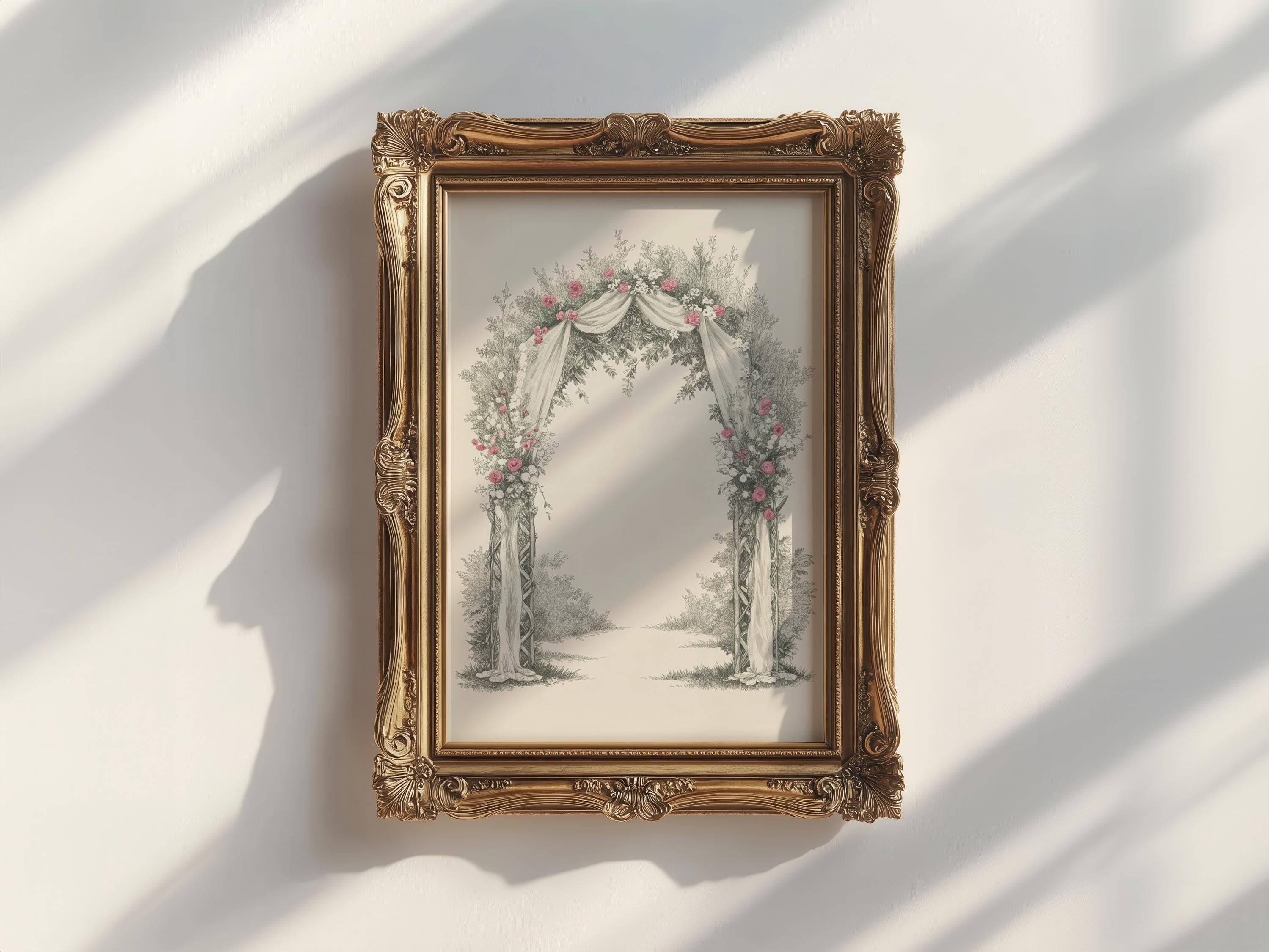 A framed picture of a floral archway is hanging on a white wall.