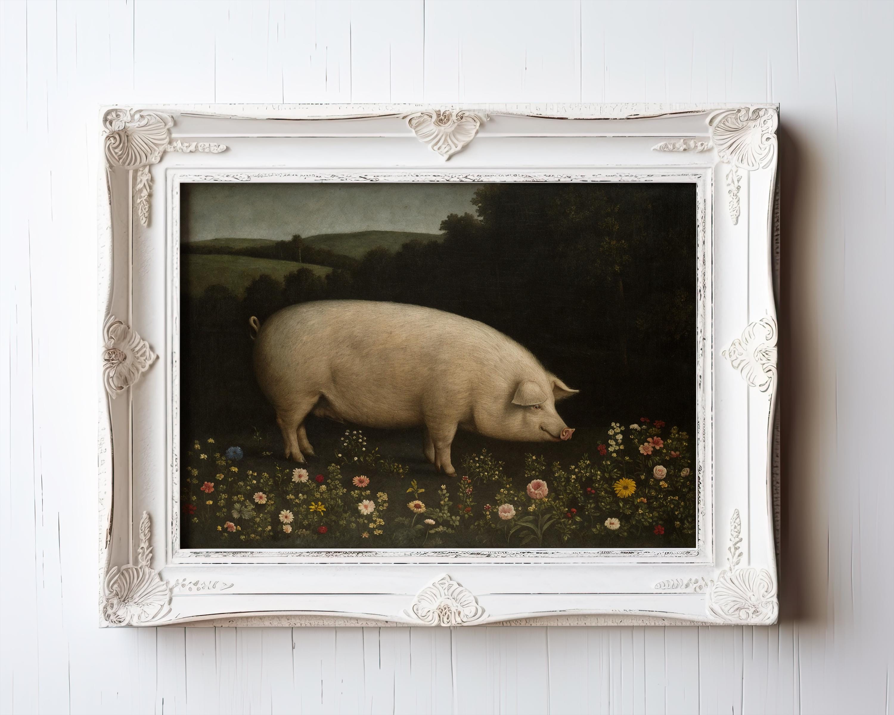 The Rustic Farmhouse Wall Art features a vintage pig print in a wildflower meadow with a countryside backdrop, perfect for country kitchen decor. This framed vintage art hangs beautifully on any white wooden wall.