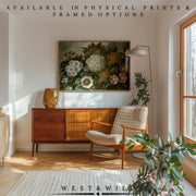 Mid-century modern living room with a wooden sideboard, beige armchair, floor lamp, houseplants, and sunlight streaming in. Enhance your space with the Botanical Floral Art Print – framed vintage blossom art from West & Wild.