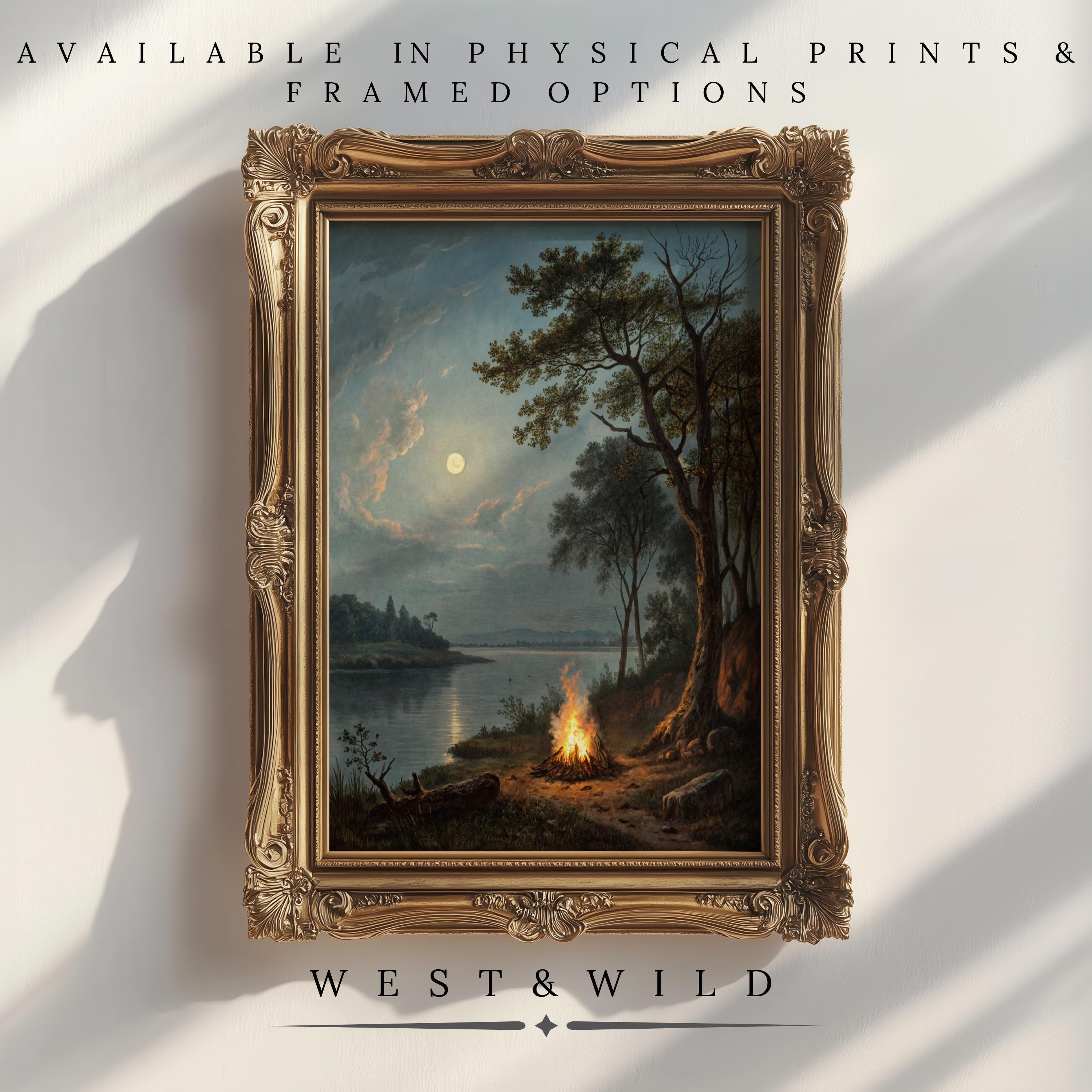 A framed “Camping Wall Art – Campfire Painting Art With Moonlit Pine Trees & Rustic Frames” hangs on the wall beneath a glowing moon. Available as vintage art prints or framed art from West & Wild Art Archive.