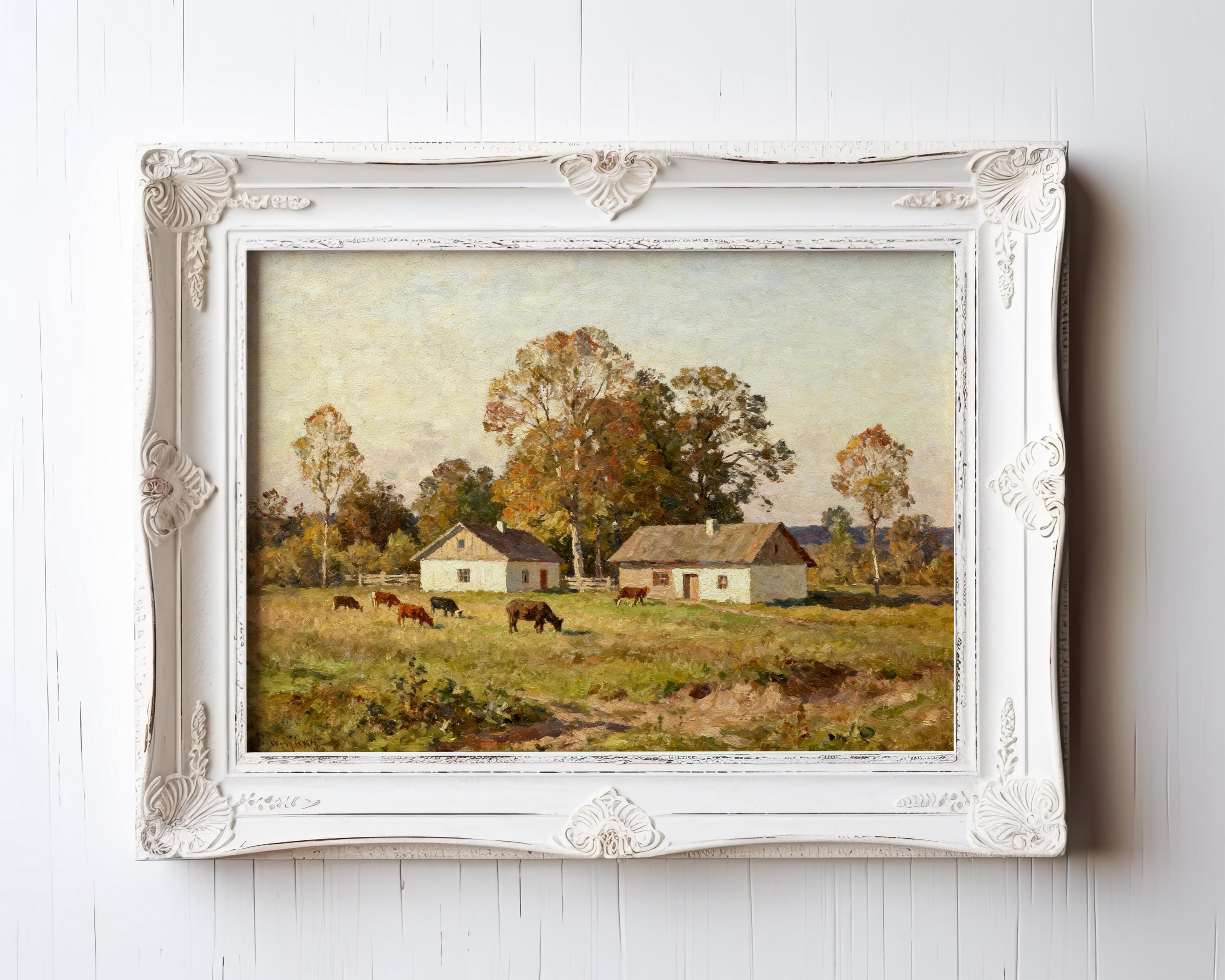 The Country Homestead Art Print – Vintage Pastoral Wall Decor with Rustic Farmhouse Charm features two white farmhouses, grazing cows, and autumn trees in a green field beneath a bright sky, all in an ornate white archival frame.