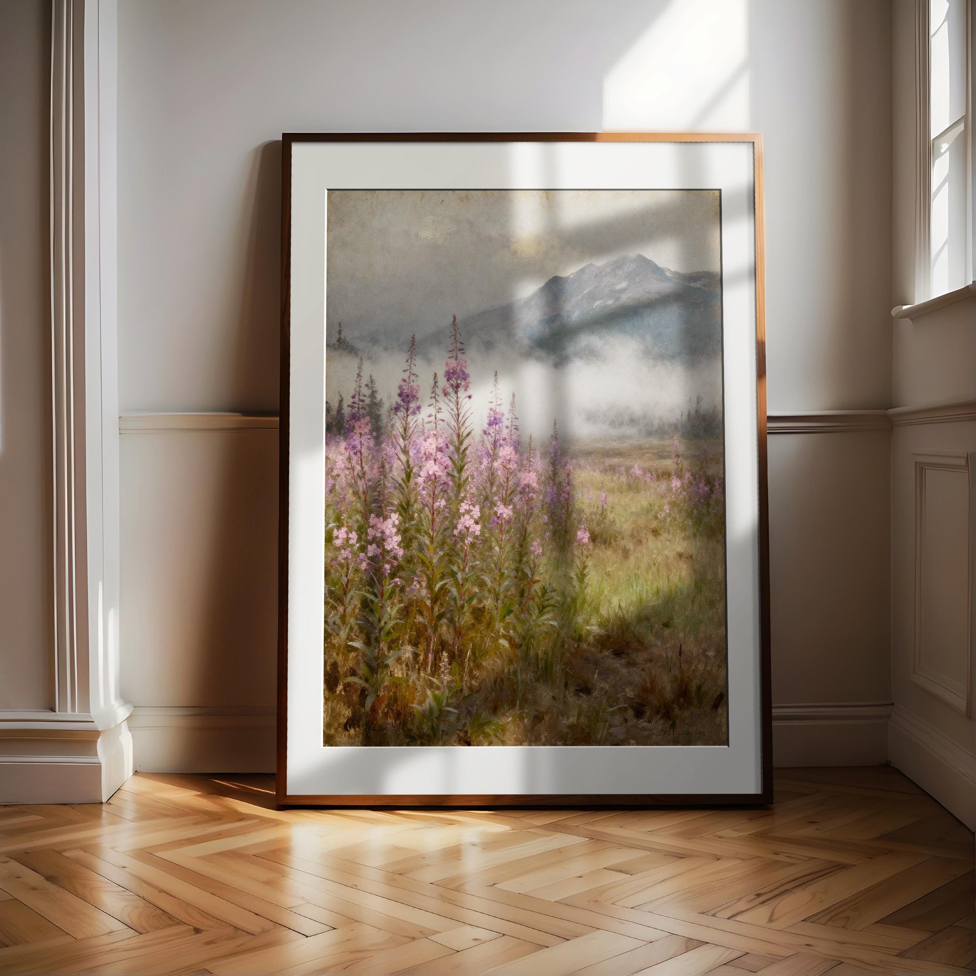 A large framed painting depicting a serene landscape with a field of purple flowers and a mountain in the background, set against a cloudy sky.