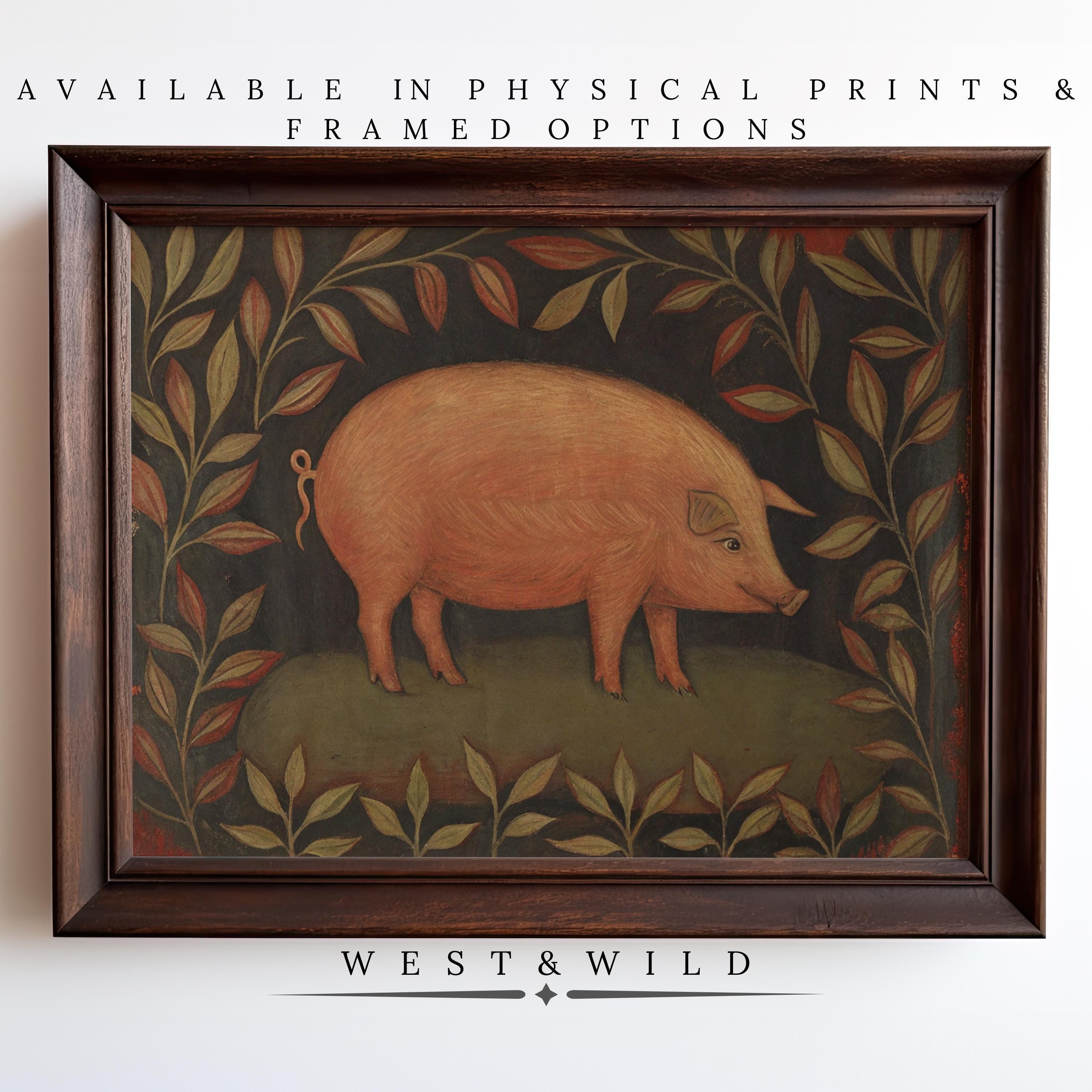 Add charming, vintage style to your space with the "Rustic Pig Art Print"—a pink pig on grass framed by leafy branches, set against a dark background. Available as prints & framed art. Text reads “West & Wild.”.