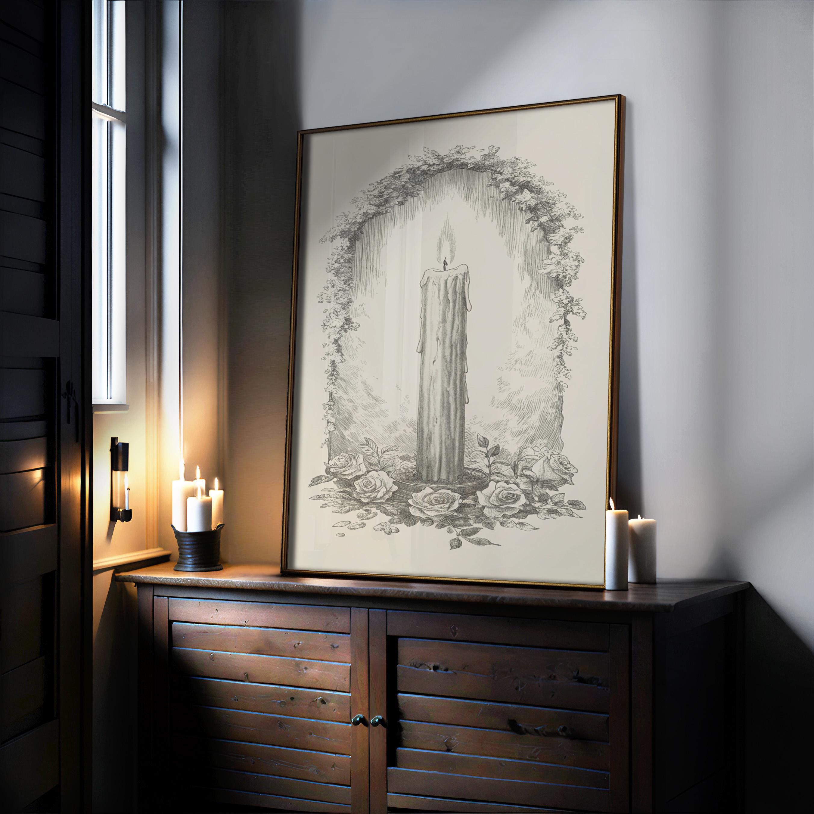 a wooden cabinet with a framed drawing of a candle on top, accompanied by two lit candles.